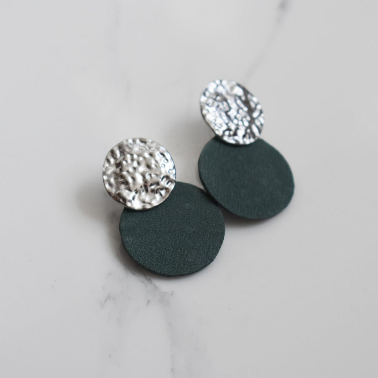 Handmade, light weight and comfortable to wear all day long leather earrings. All our earring hooks are made with a high quality stainless steel and they are hypo allergenic.  They will not tarnish or irritate your sensitive skin.