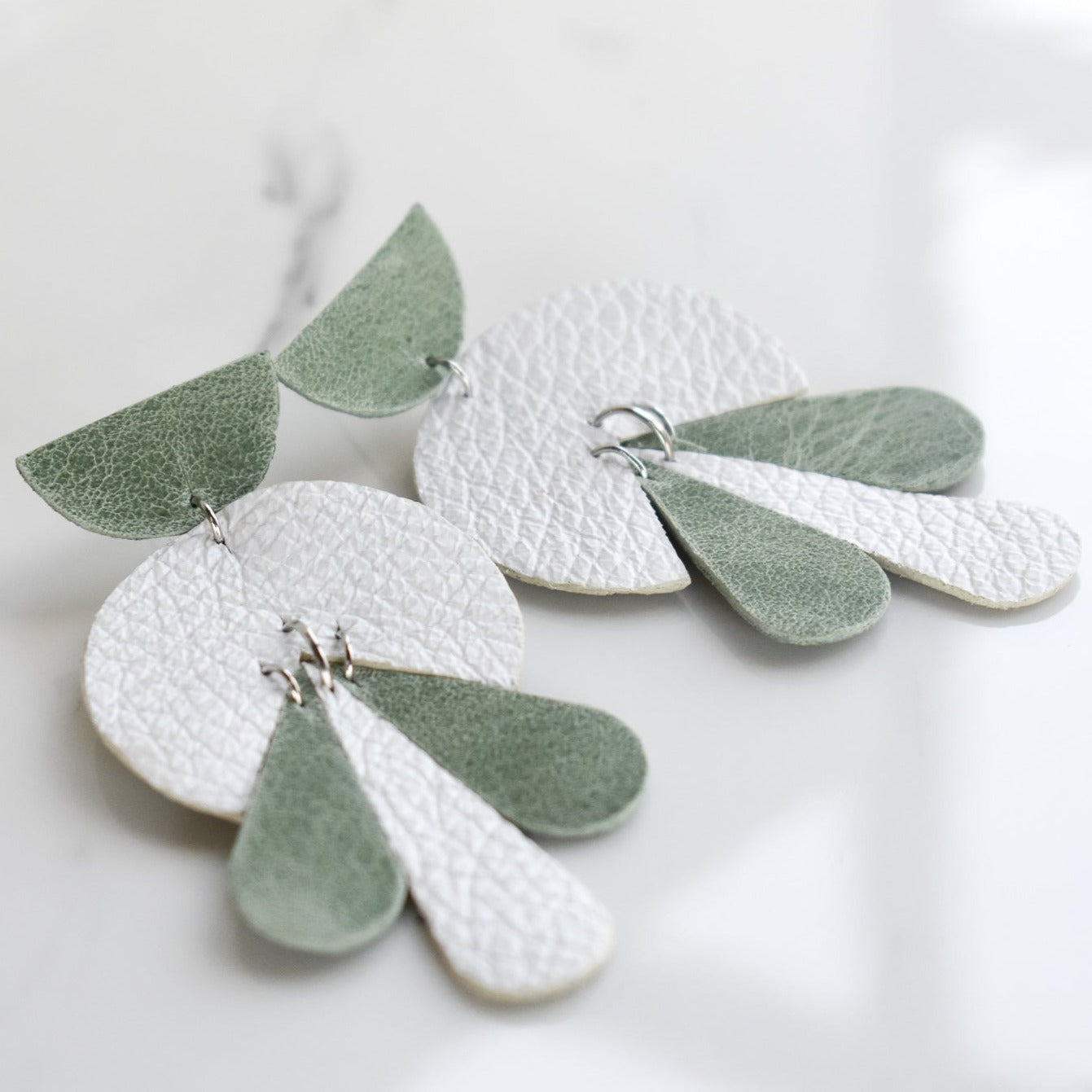 Handmade, light weight and comfortable to wear all day long leather earrings. All our earring hooks are made with a high quality stainless steel and they are hypo allergenic.  They will not tarnish or irritate your sensitive skin.