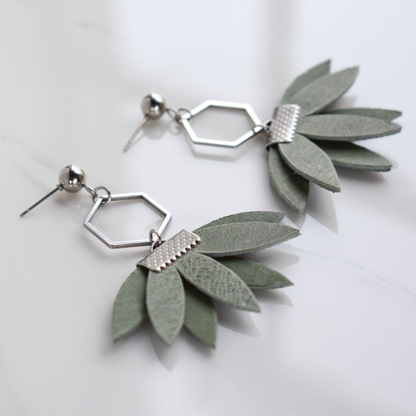 Handmade, light weight and comfortable to wear all day long leather earrings. All our earring hooks are made with a high quality stainless steel and they are hypo allergenic.  They will not tarnish or irritate your sensitive skin.