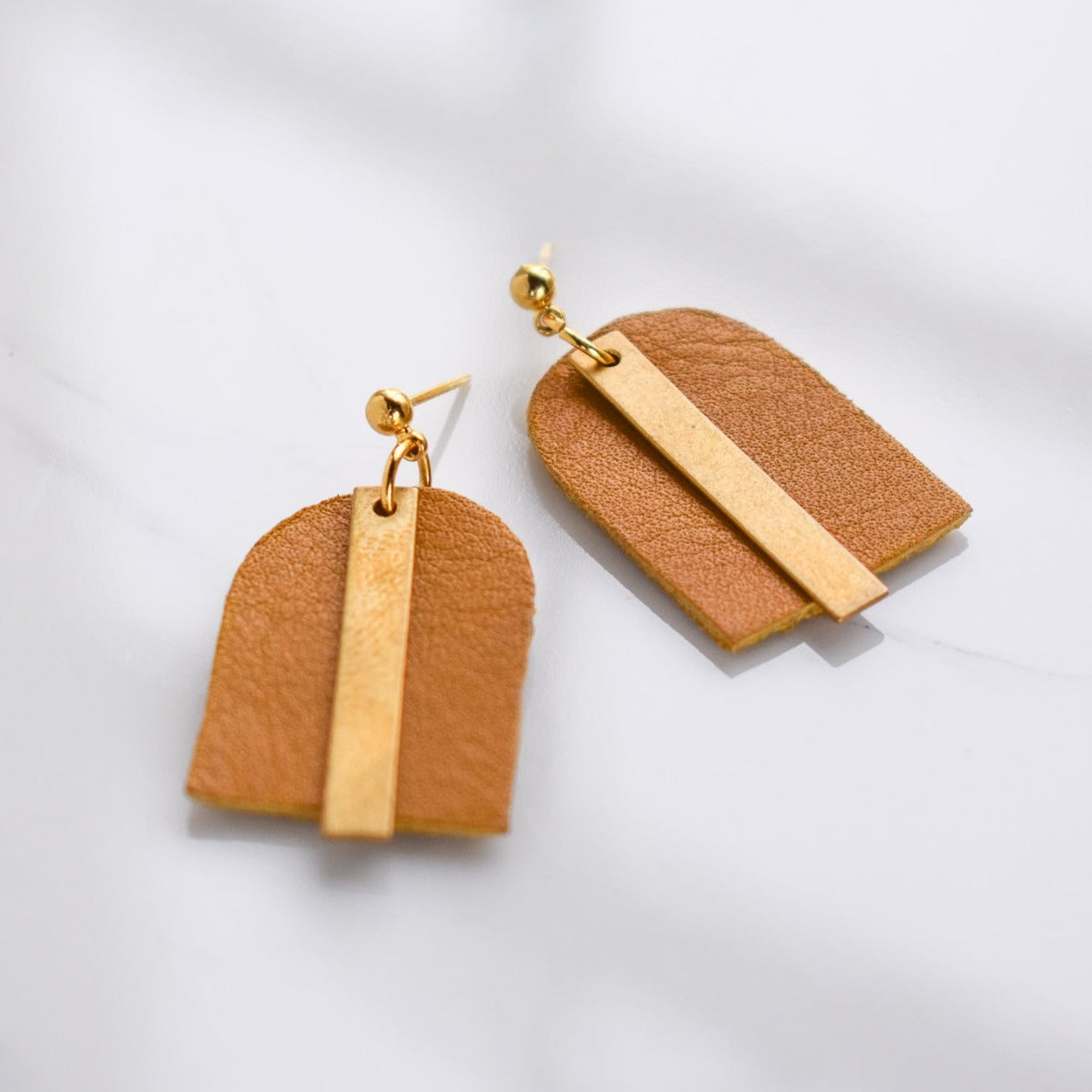 Handmade, light weight and comfortable to wear all day long leather earrings. All our earring hooks are made with a high quality stainless steel and they are hypo allergenic.  They will not tarnish or irritate your sensitive skin.