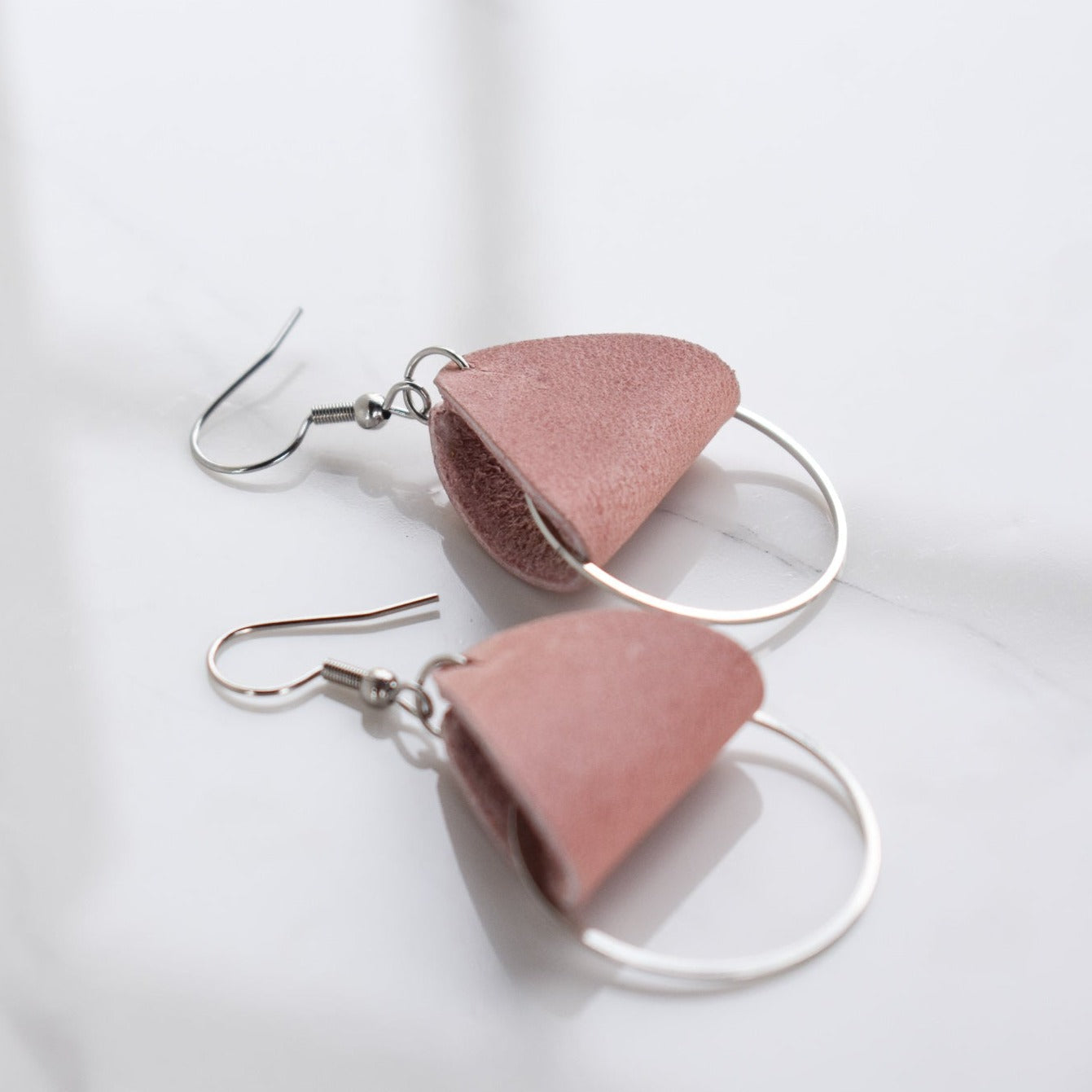 Handmade, light weight and comfortable to wear all day long leather earrings. All our earring hooks are made with a high quality stainless steel and they are hypo allergenic.  They will not tarnish or irritate your sensitive skin.