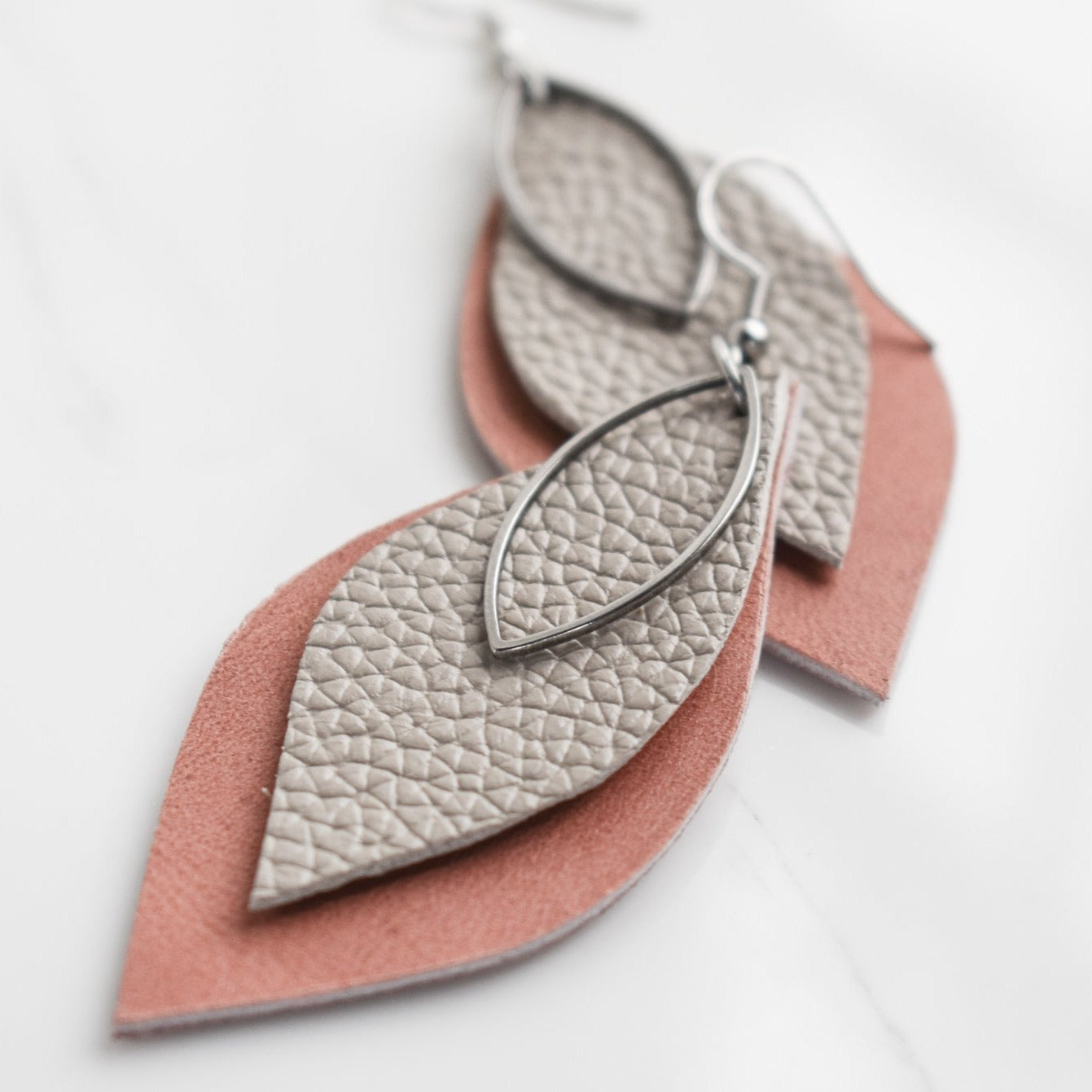 Handmade, light weight and comfortable to wear all day long leather earrings. All our earring hooks are made with a high quality stainless steel and they are hypo allergenic.  They will not tarnish or irritate your sensitive skin.