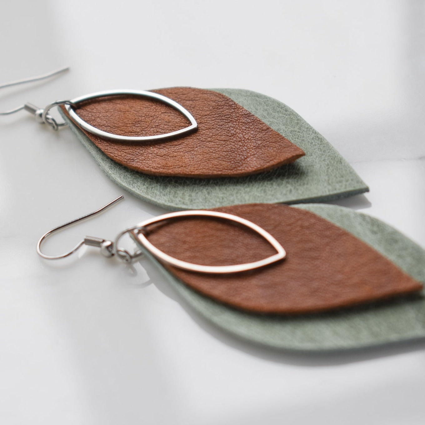 Handmade, light weight and comfortable to wear all day long leather earrings. All our earring hooks are made with a high quality stainless steel and they are hypo allergenic.  They will not tarnish or irritate your sensitive skin.