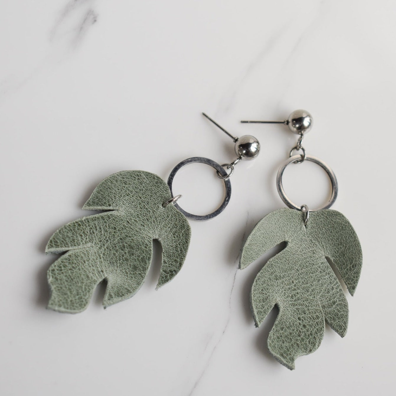 Handmade, light weight and comfortable to wear all day long leather earrings. All our earring hooks are made with a high quality stainless steel and they are hypo allergenic.  They will not tarnish or irritate your sensitive skin.