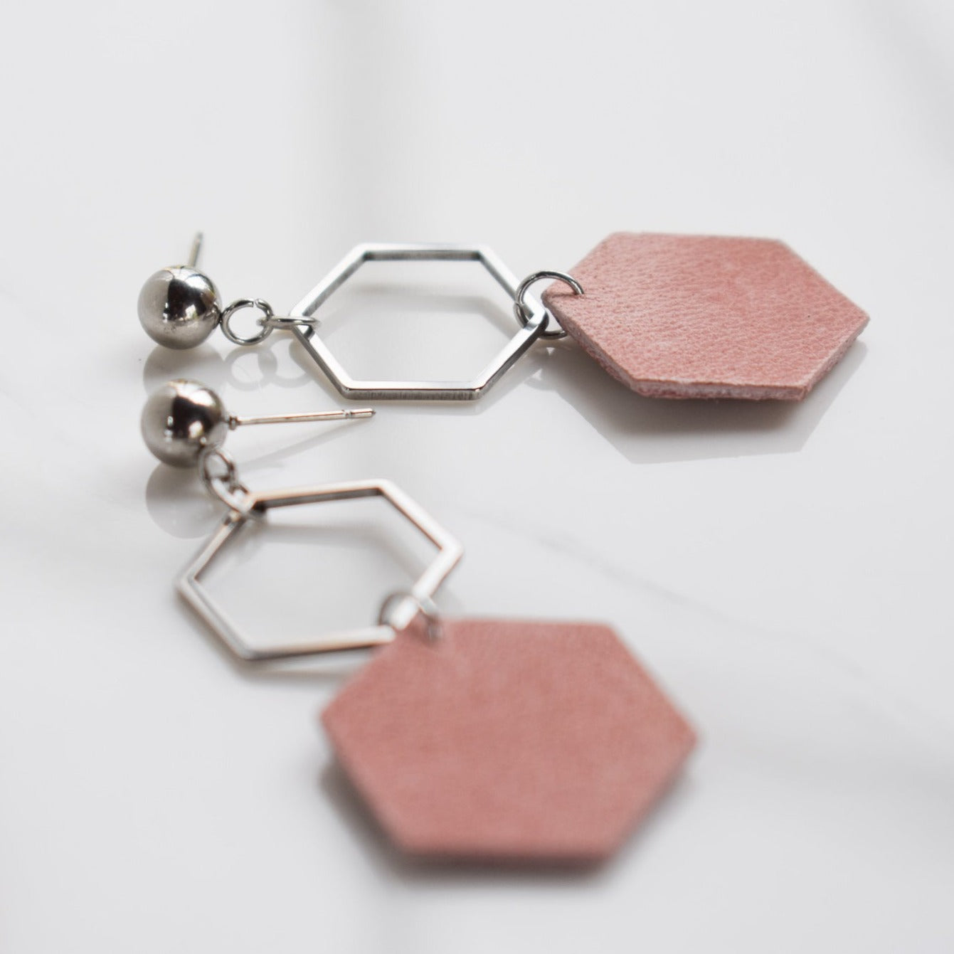 Handmade, light weight and comfortable to wear all day long leather earrings. All our earring hooks are made with a high quality stainless steel and they are hypo allergenic.  They will not tarnish or irritate your sensitive skin.