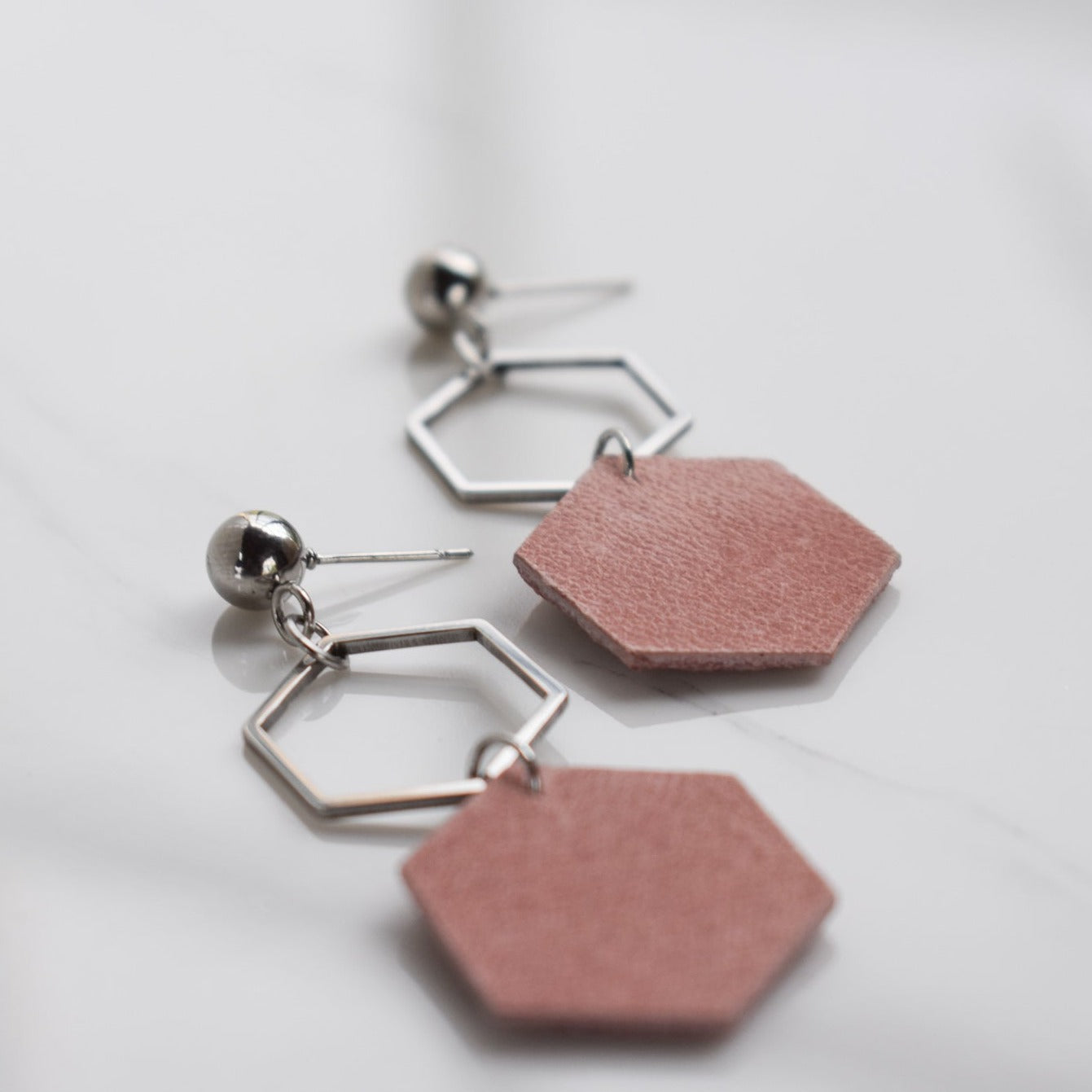 Handmade, light weight and comfortable to wear all day long leather earrings. All our earring hooks are made with a high quality stainless steel and they are hypo allergenic.  They will not tarnish or irritate your sensitive skin.