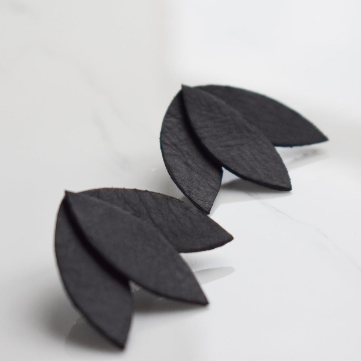 Handmade, light weight and comfortable to wear all day long leather earrings. All our earring hooks are made with a high quality stainless steel and they are hypo allergenic.  They will not tarnish or irritate your sensitive skin.