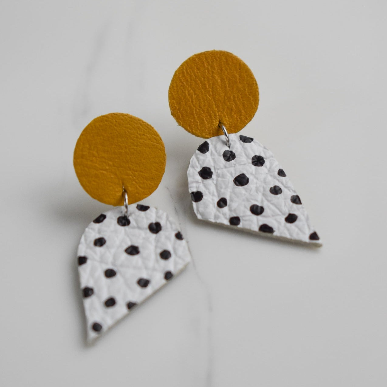 Handmade, light weight and comfortable to wear all day long leather earrings. All our earring hooks are made with a high quality stainless steel and they are hypo allergenic.  They will not tarnish or irritate your sensitive skin.