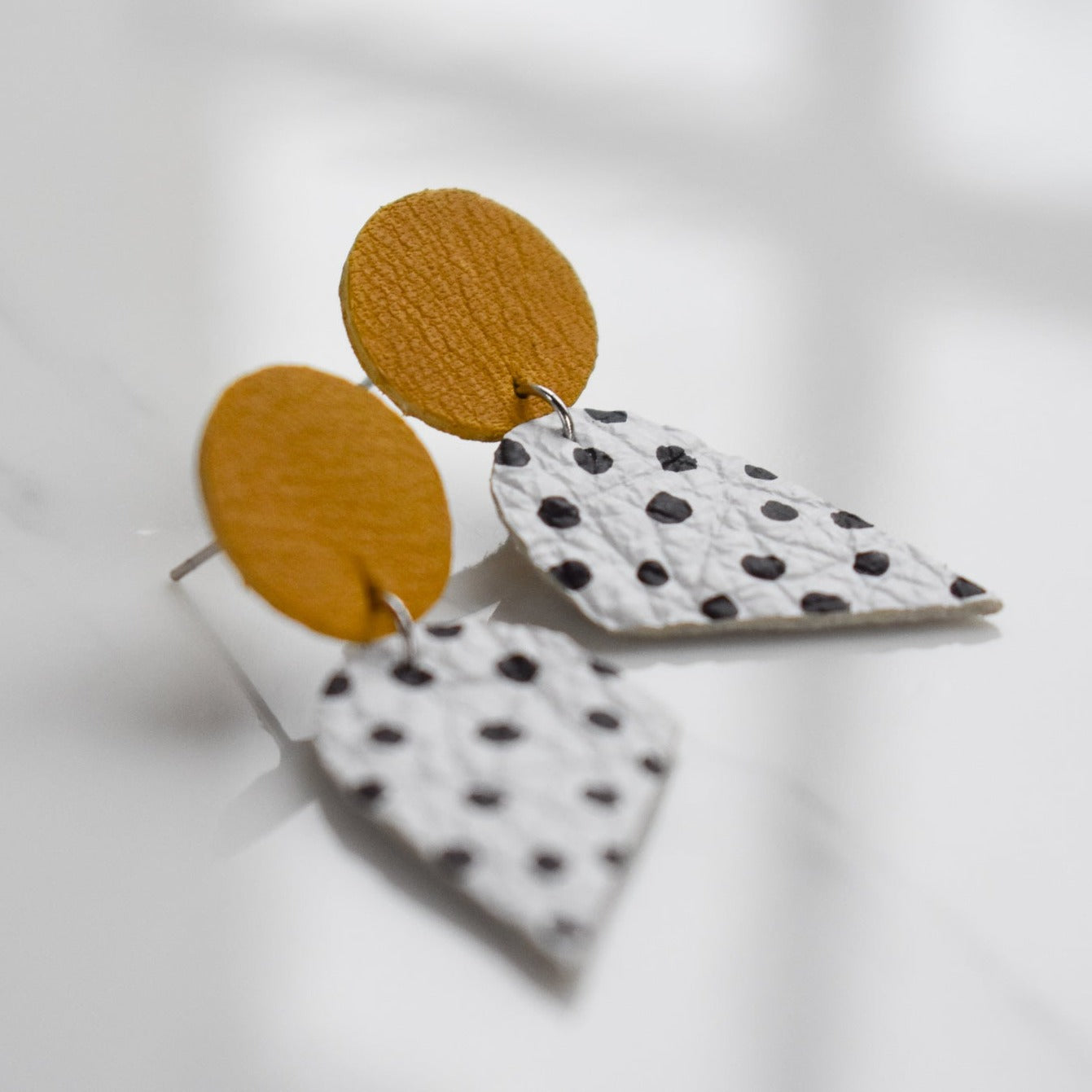 Handmade, light weight and comfortable to wear all day long leather earrings. All our earring hooks are made with a high quality stainless steel and they are hypo allergenic.  They will not tarnish or irritate your sensitive skin.