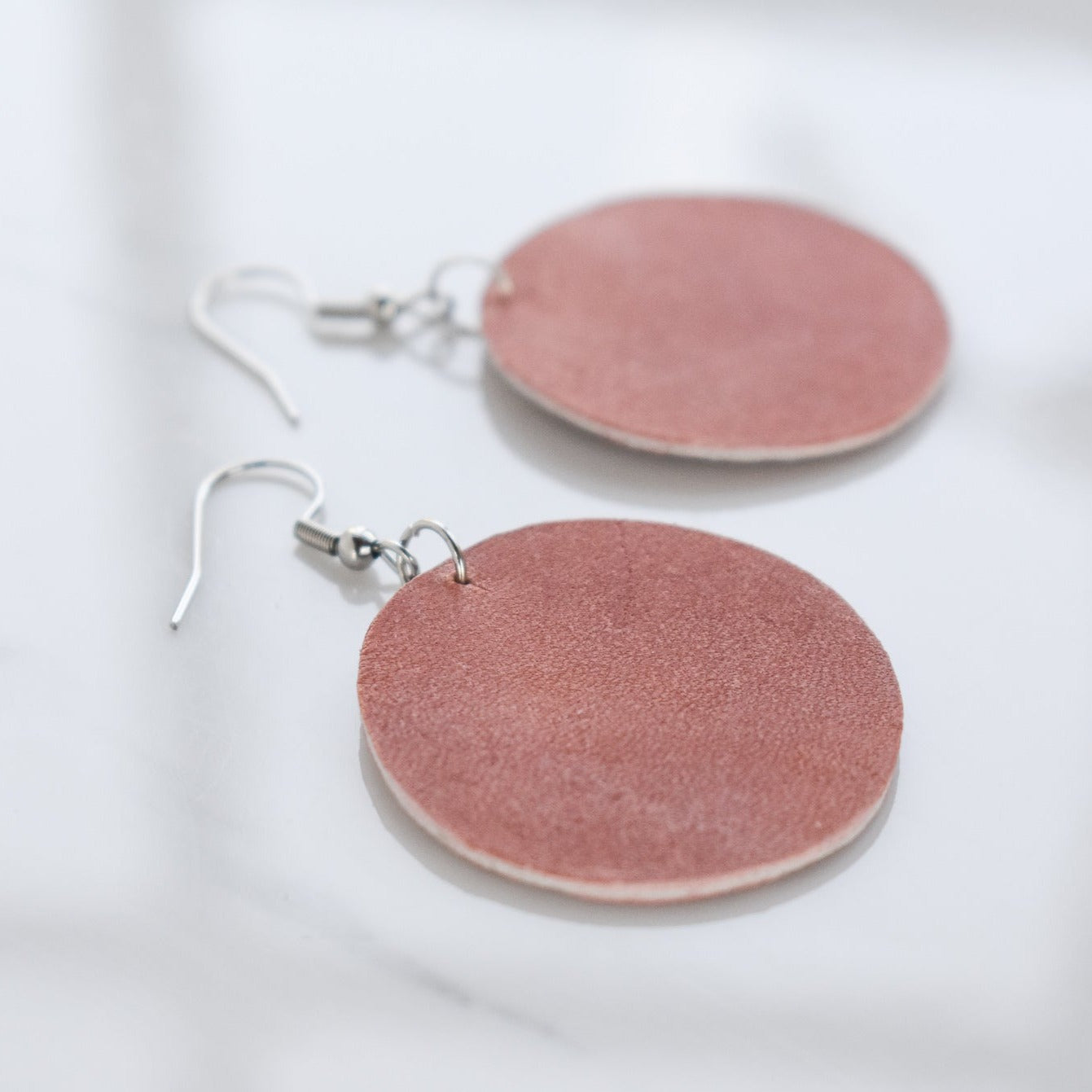 Handmade, light weight and comfortable to wear all day long leather earrings. Available in silver gold or rose gold. All our earring hooks are made with a high quality stainless steel and they are hypo allergenic.  They will not tarnish or irritate your sensitive skin.