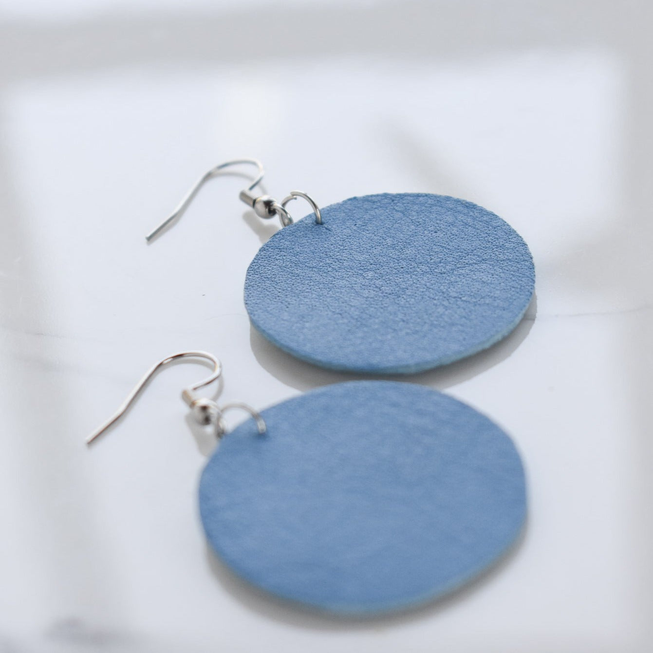 Handmade, light weight and comfortable to wear all day long leather earrings. Available in silver gold or rose gold. All our earring hooks are made with a high quality stainless steel and they are hypo allergenic.  They will not tarnish or irritate your sensitive skin.