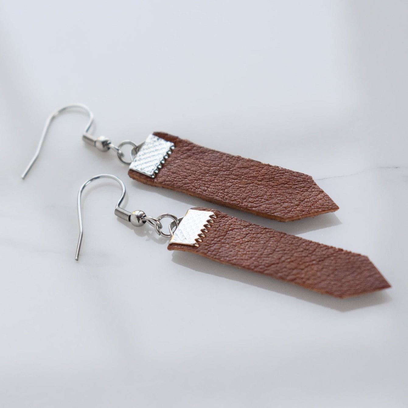 Handmade, light weight and comfortable to wear all day long leather earrings. All our earring hooks are made with a high quality stainless steel and they are hypo allergenic.  They will not tarnish or irritate your sensitive skin.