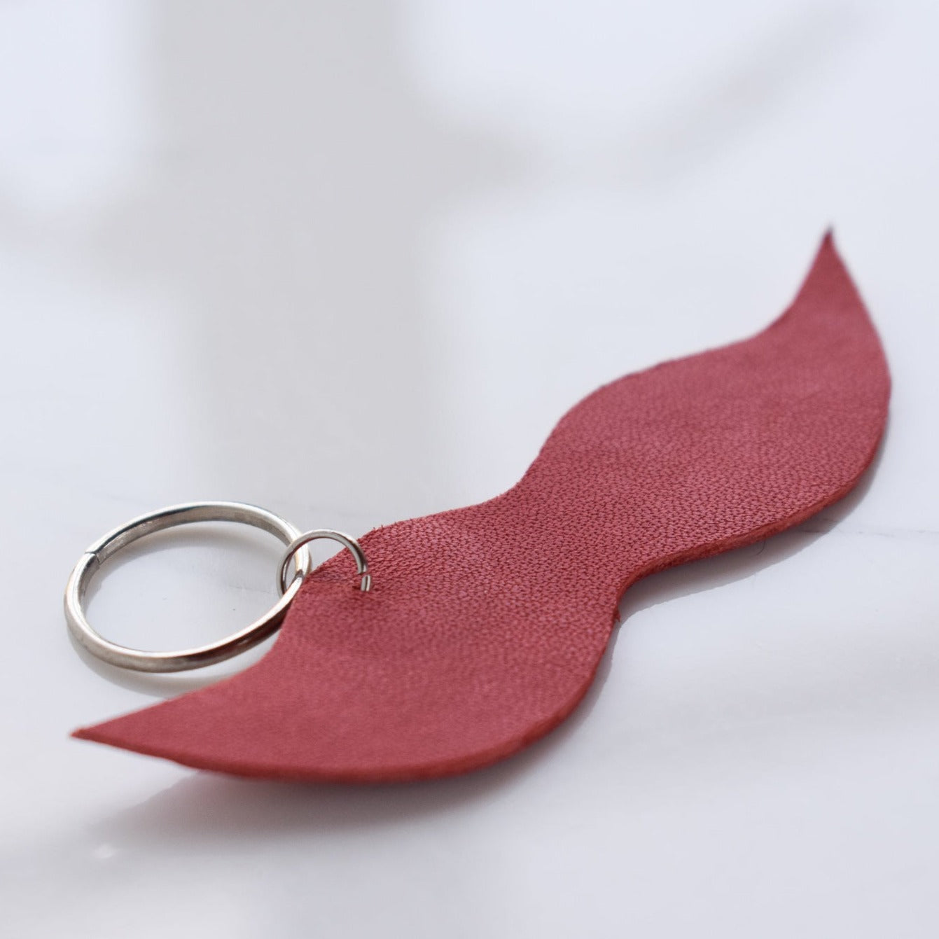 Beautifully hand made leather keychain. A perfect addition to a gift or a great thank you gift for a wedding. 