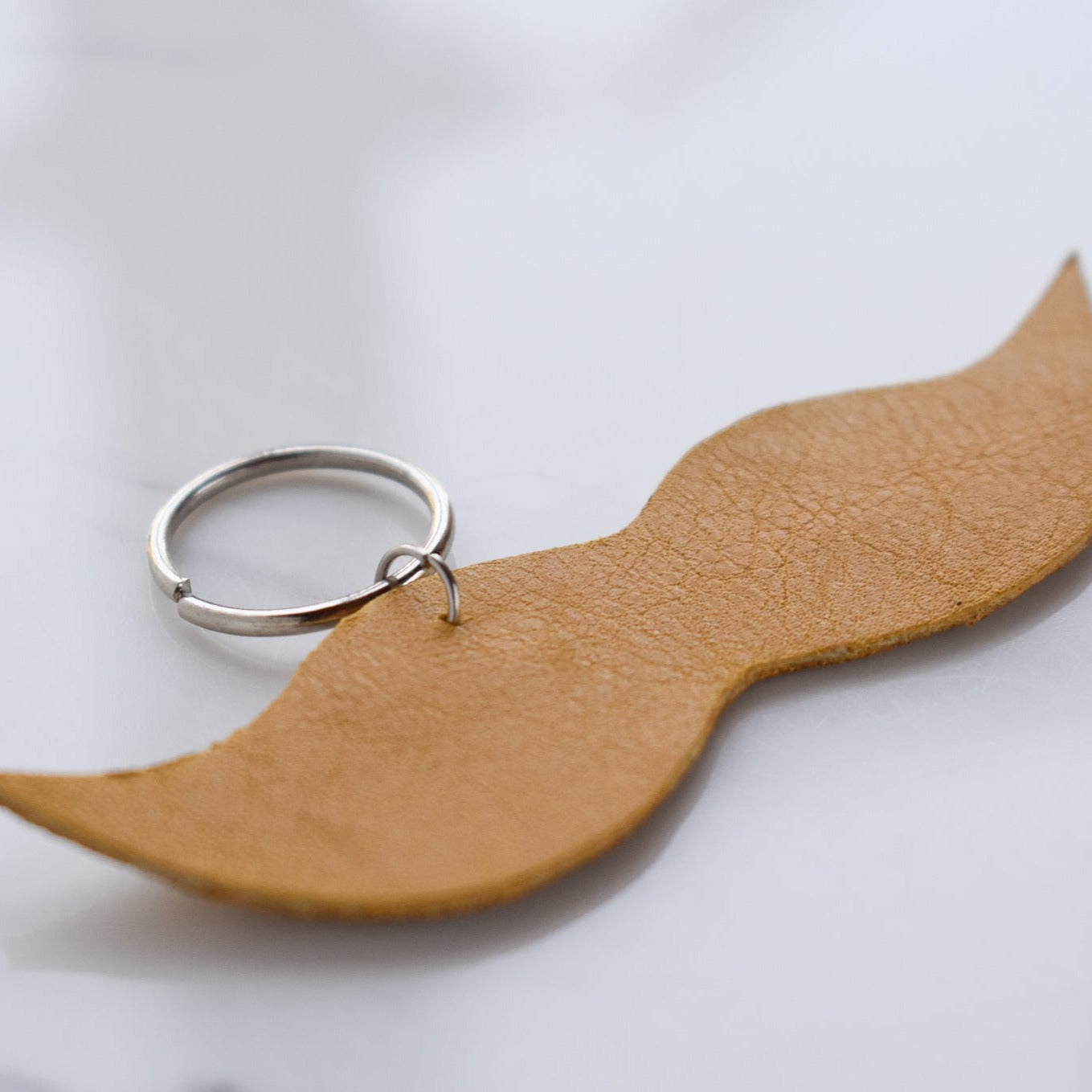 Beautifully hand made leather keychain. A perfect addition to a gift or a great thank you gift for a wedding. 