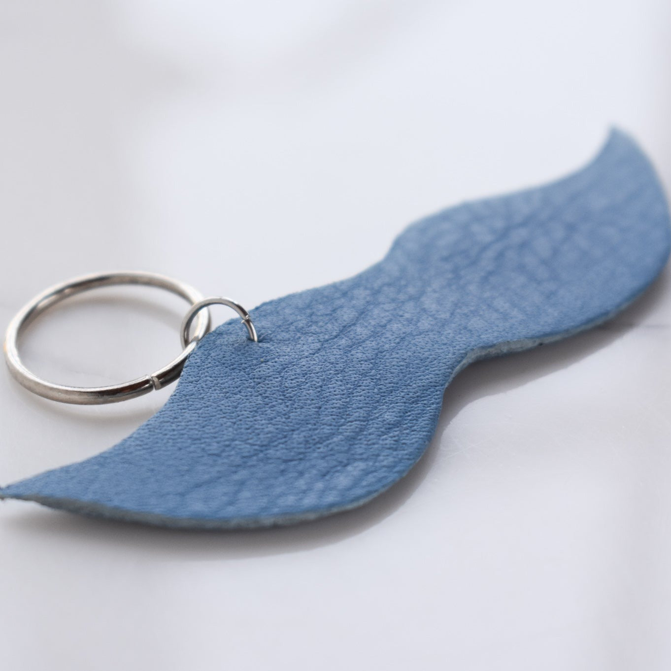 Beautifully hand made leather keychain. A perfect addition to a gift or a great thank you gift for a wedding. 