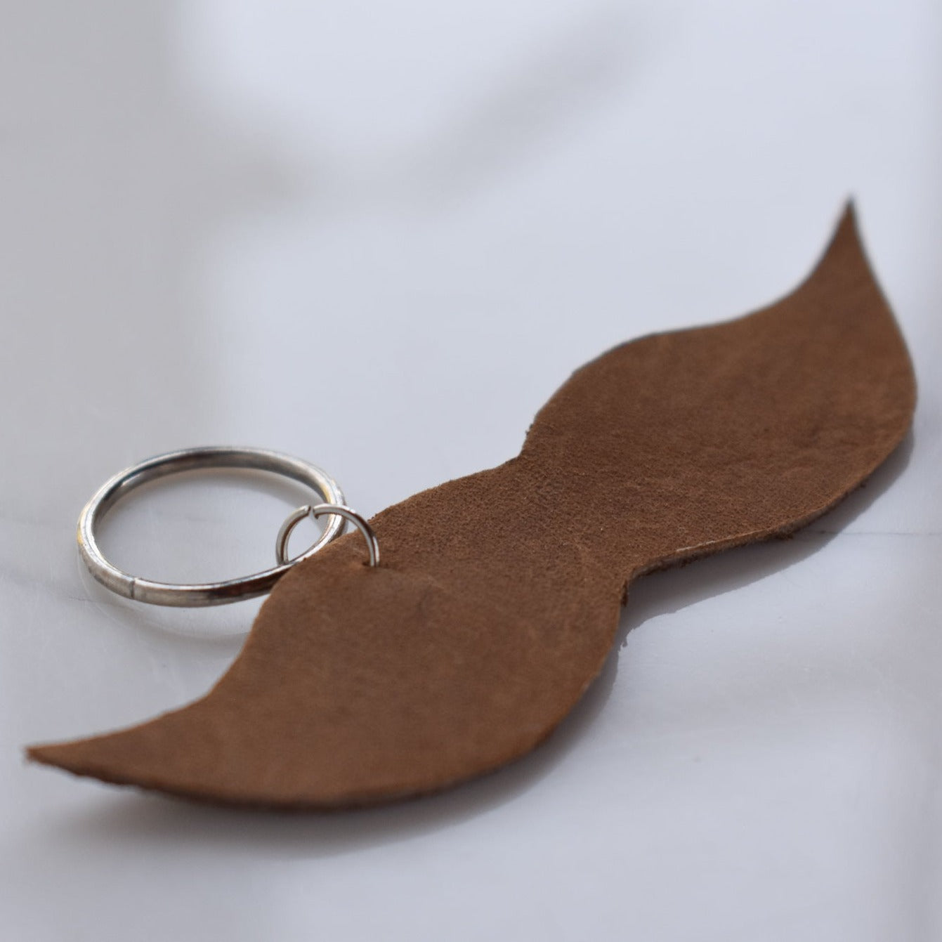 Beautifully hand made leather keychain. A perfect addition to a gift or a great thank you gift for a wedding. 