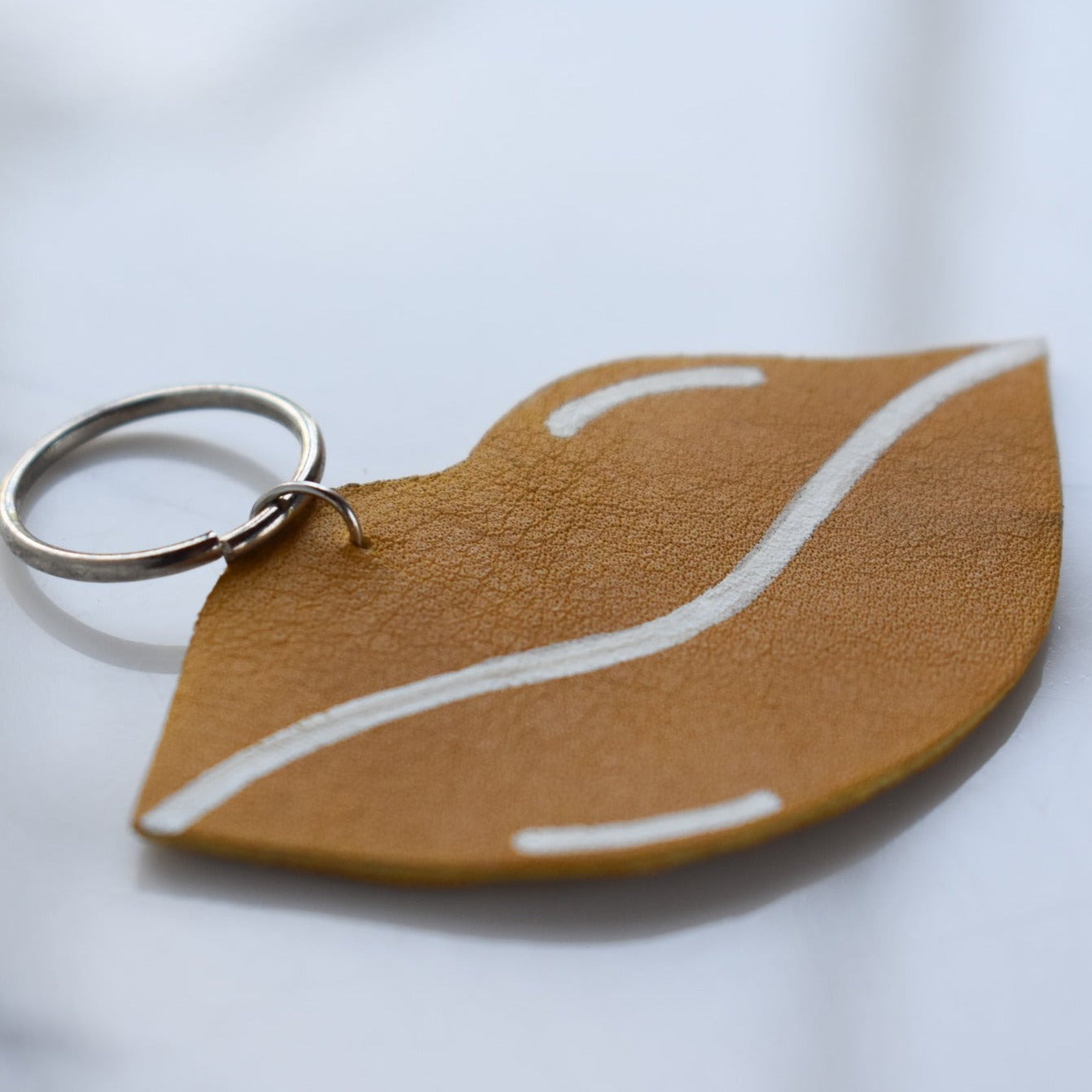 Beautifully hand made leather keychain. A perfect addition to a gift or a great thank you gift for a wedding. 