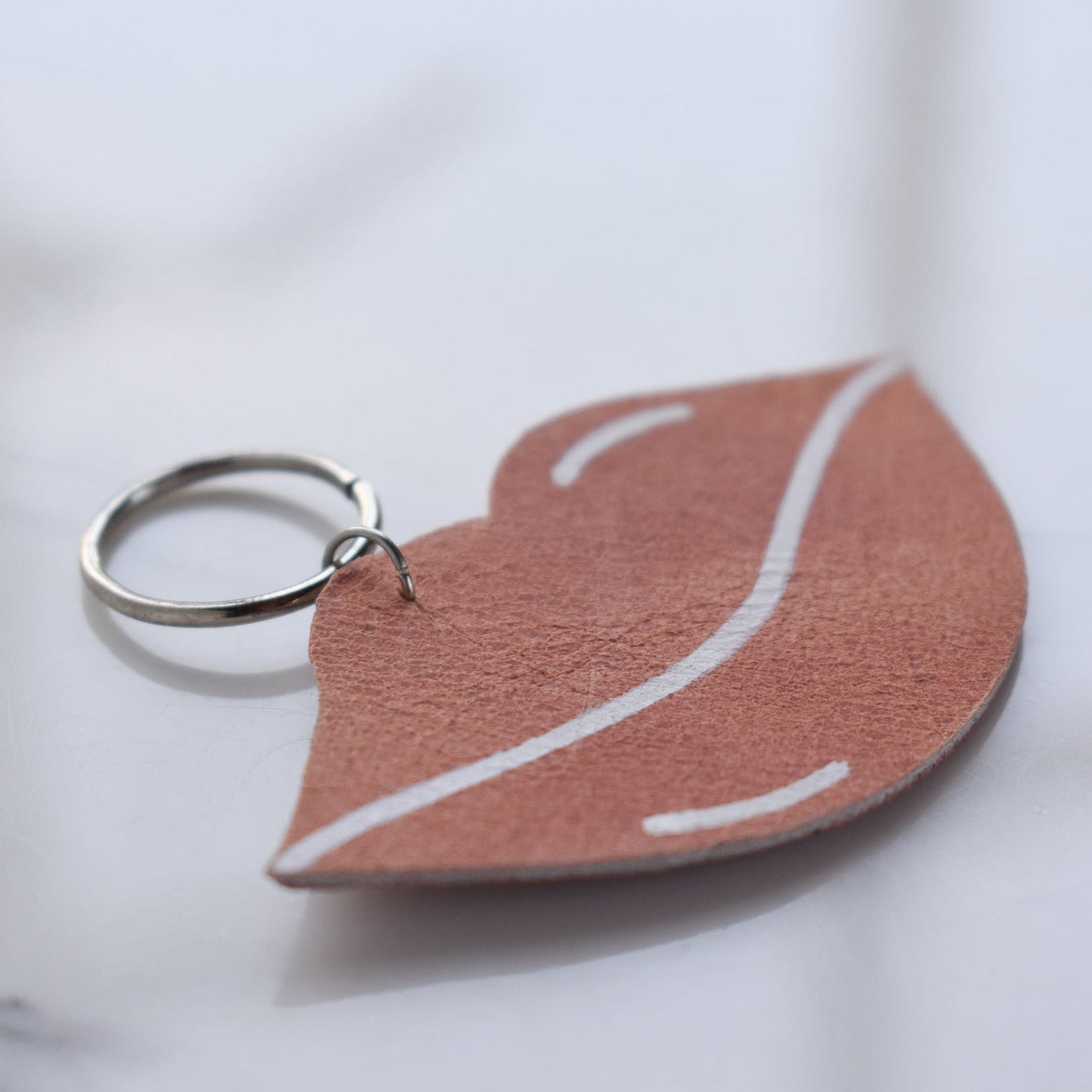 Beautifully hand made leather keychain. A perfect addition to a gift or a great thank you gift for a wedding. 