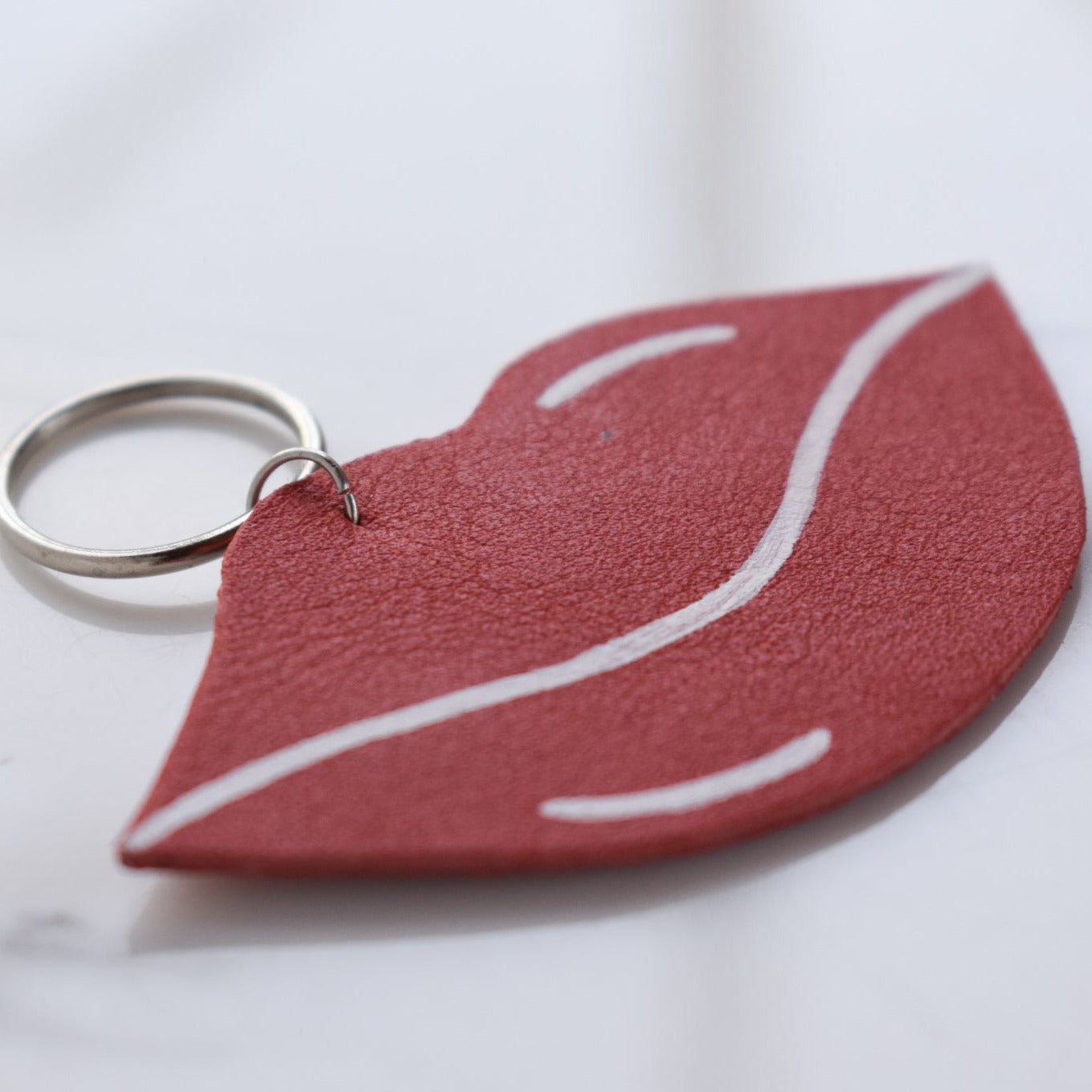 Beautifully hand made leather keychain. A perfect addition to a gift or a great thank you gift for a wedding. 