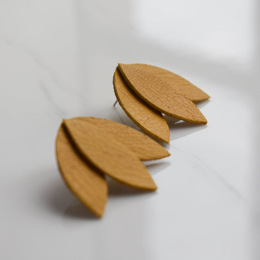 Handmade, light weight and comfortable to wear all day long leather earrings. All our earring hooks are made with a high quality stainless steel and they are hypo allergenic.  They will not tarnish or irritate your sensitive skin.