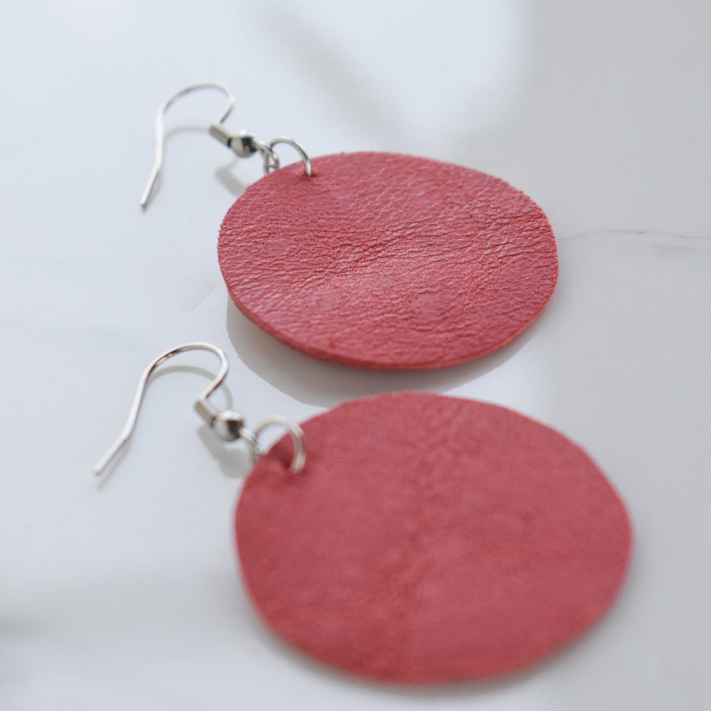 Handmade, light weight and comfortable to wear all day long leather earrings. Available in silver gold or rose gold. All our earring hooks are made with a high quality stainless steel and they are hypo allergenic.  They will not tarnish or irritate your sensitive skin.