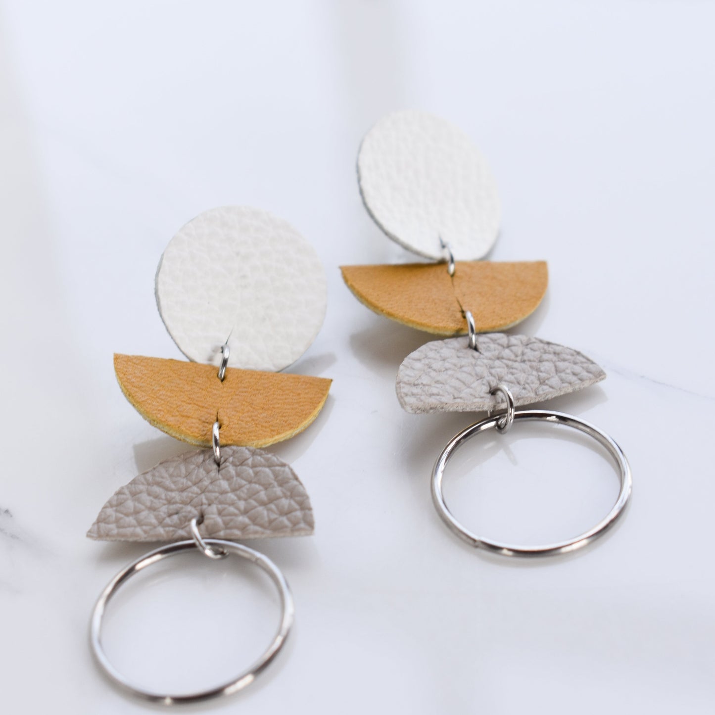 Handmade, light weight and comfortable to wear all day long leather earrings. All our earring hooks are made with a high quality stainless steel and they are hypo allergenic.  They will not tarnish or irritate your sensitive skin.