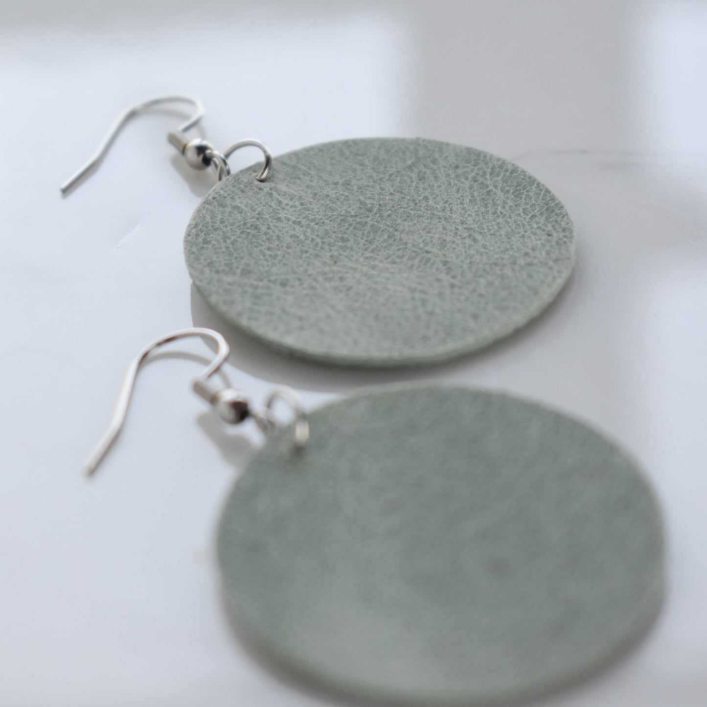 Handmade, light weight and comfortable to wear all day long leather earrings. Available in silver gold or rose gold. All our earring hooks are made with a high quality stainless steel and they are hypo allergenic.  They will not tarnish or irritate your sensitive skin.