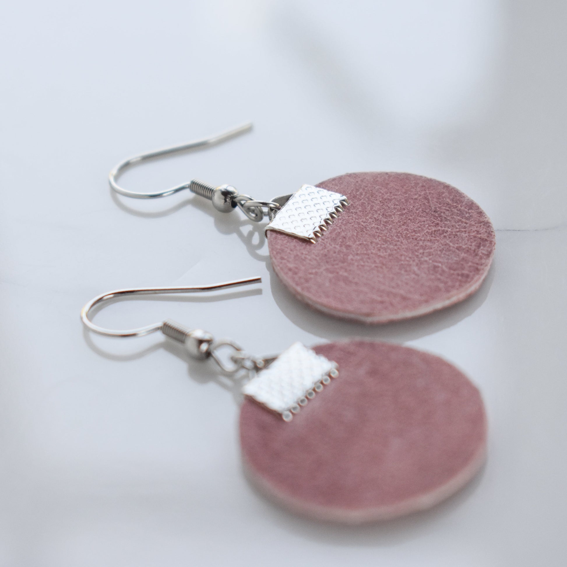 Handmade, light weight and comfortable to wear all day long leather earrings. All our earring hooks are made with a high quality stainless steel and they are hypo allergenic.  They will not tarnish or irritate your sensitive skin.