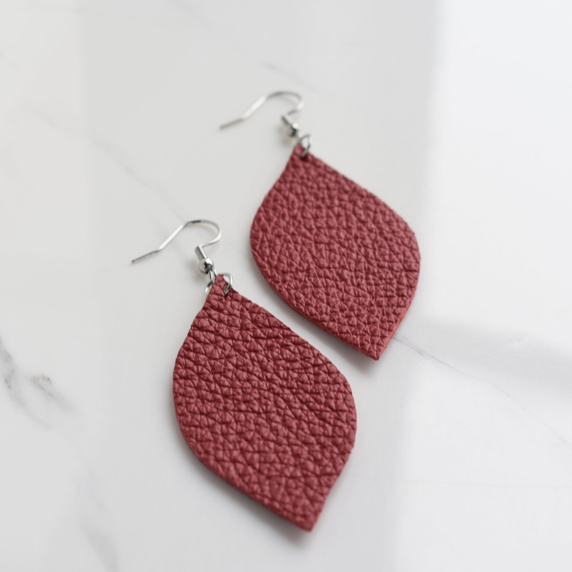 Handmade, light weight and comfortable to wear all day long leather earrings. All our earring hooks are made with a high quality stainless steel and they are hypo allergenic.  They will not tarnish or irritate your sensitive skin.