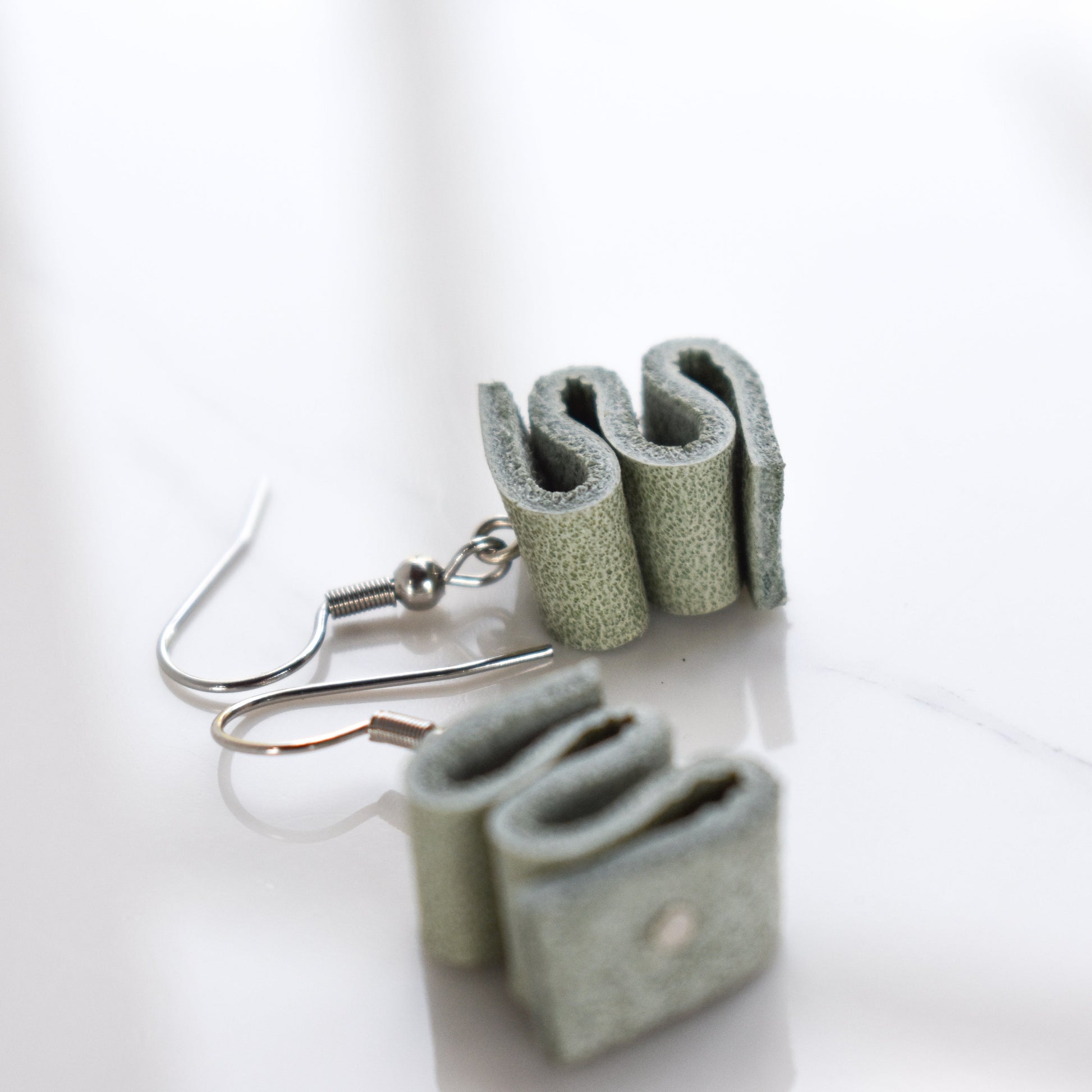 Handmade, light weight and comfortable to wear all day long leather earrings. All our earring hooks are made with a high quality stainless steel and they are hypo allergenic.  They will not tarnish or irritate your sensitive skin.