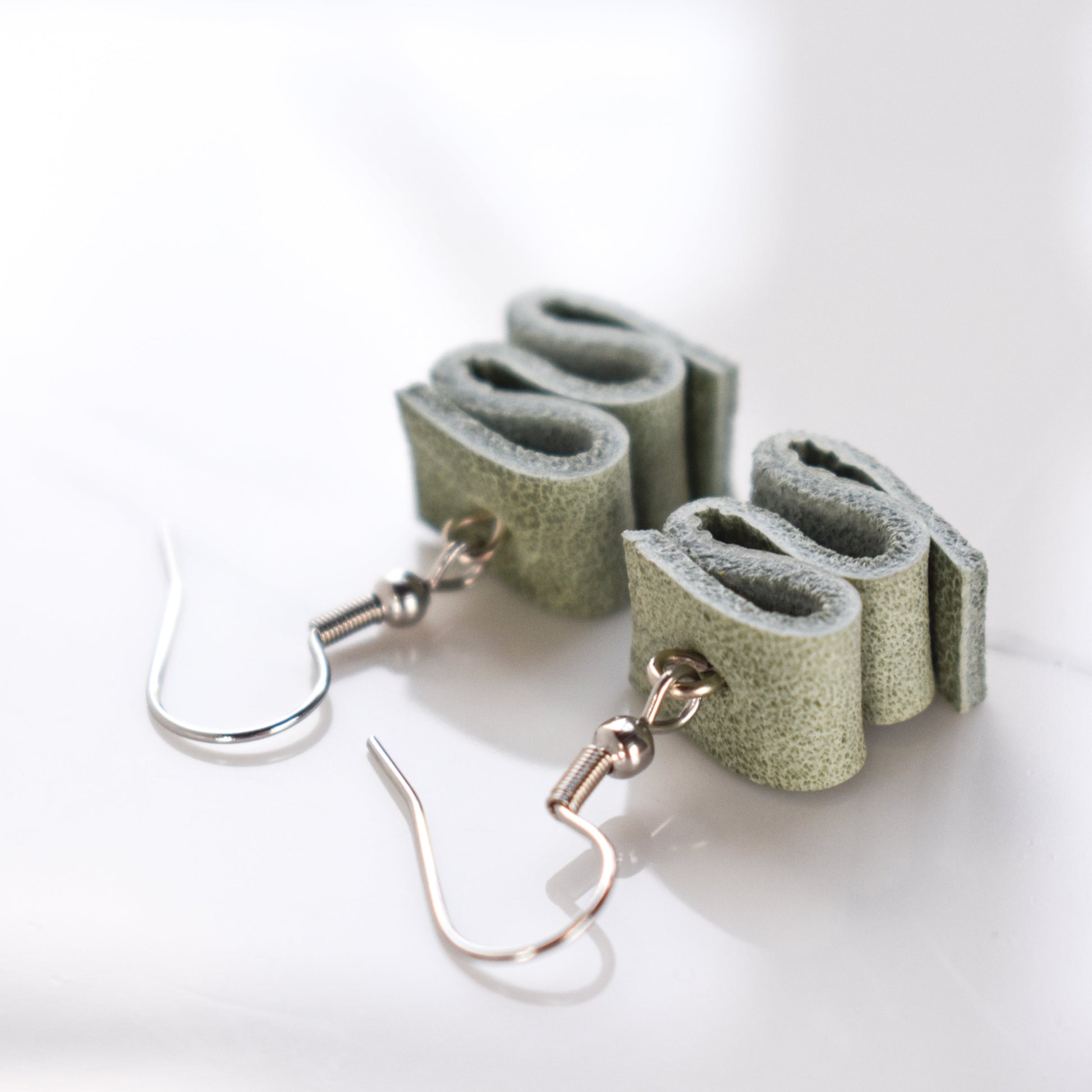 Handmade, light weight and comfortable to wear all day long leather earrings. All our earring hooks are made with a high quality stainless steel and they are hypo allergenic.  They will not tarnish or irritate your sensitive skin.