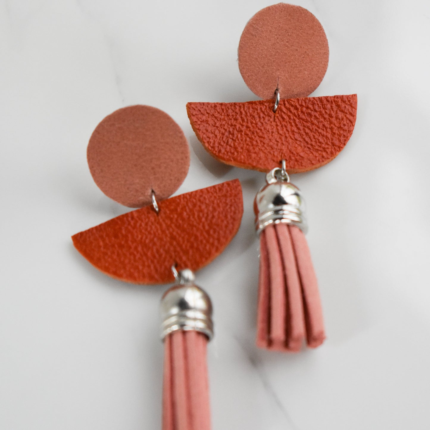 Handmade, light weight and comfortable to wear all day long leather earrings. All our earring hooks are made with a high quality stainless steel and they are hypo allergenic.  They will not tarnish or irritate your sensitive skin.