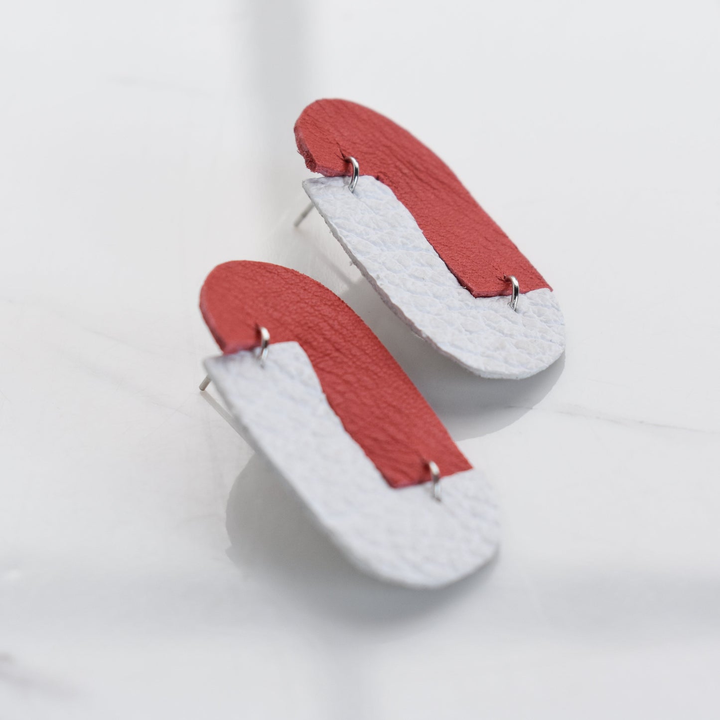 Handmade, light weight and comfortable to wear all day long leather earrings. All our earring hooks are made with a high quality stainless steel and they are hypo allergenic.  They will not tarnish or irritate your sensitive skin.