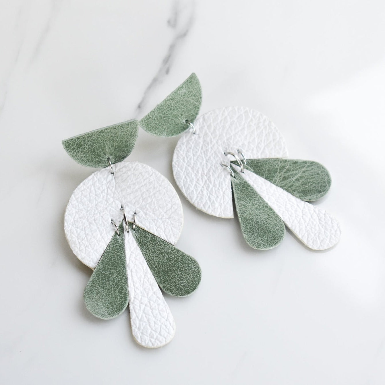 LEATHER_EARRING Handmade, light weight and comfortable to wear all day long leather earrings. All our earring hooks are made with a high quality stainless steel and they are hypo allergenic.  They will not tarnish or irritate your sensitive skin.