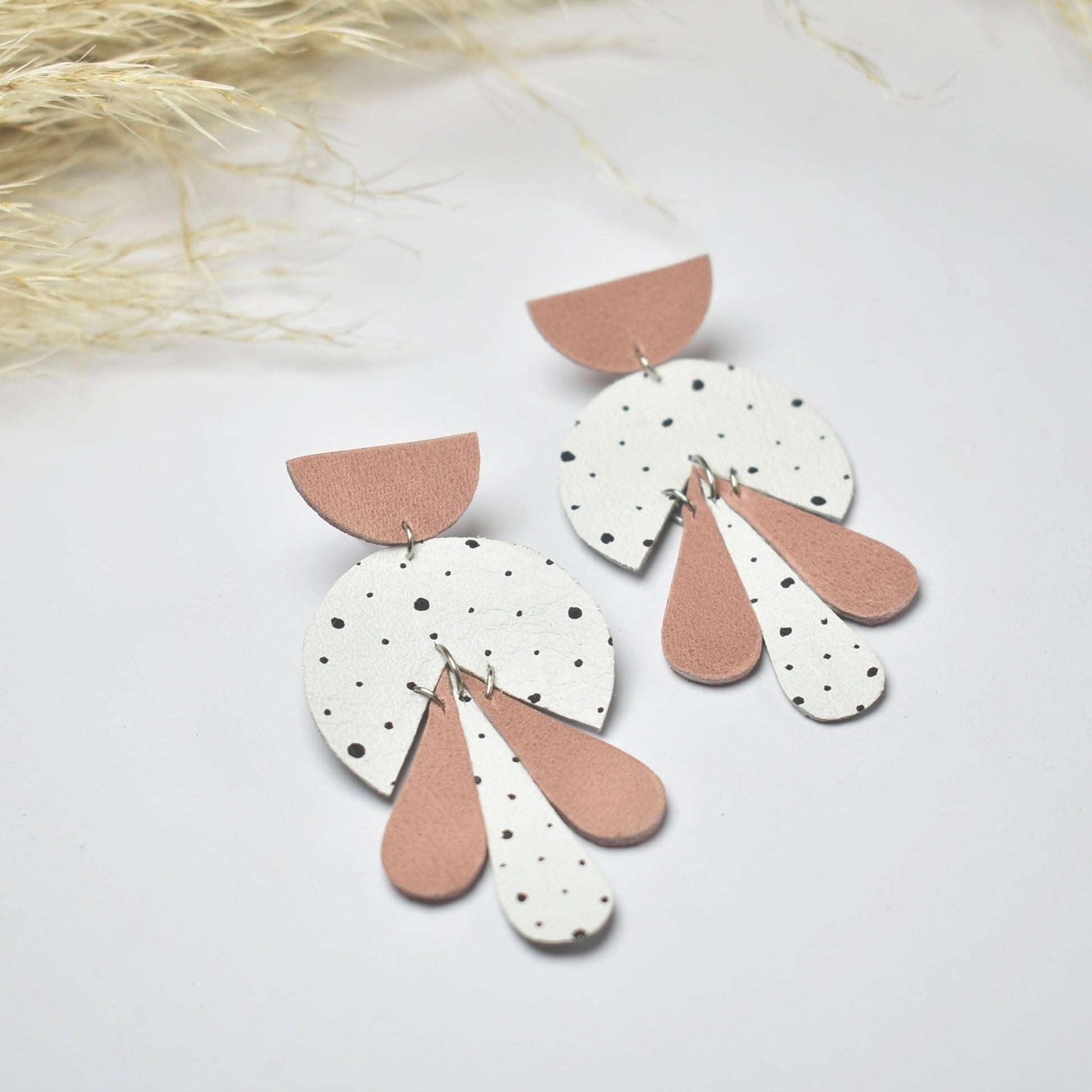 LEATHER_EARRING Handmade, light weight and comfortable to wear all day long leather earrings. All our earring hooks are made with a high quality stainless steel and they are hypo allergenic.  They will not tarnish or irritate your sensitive skin.