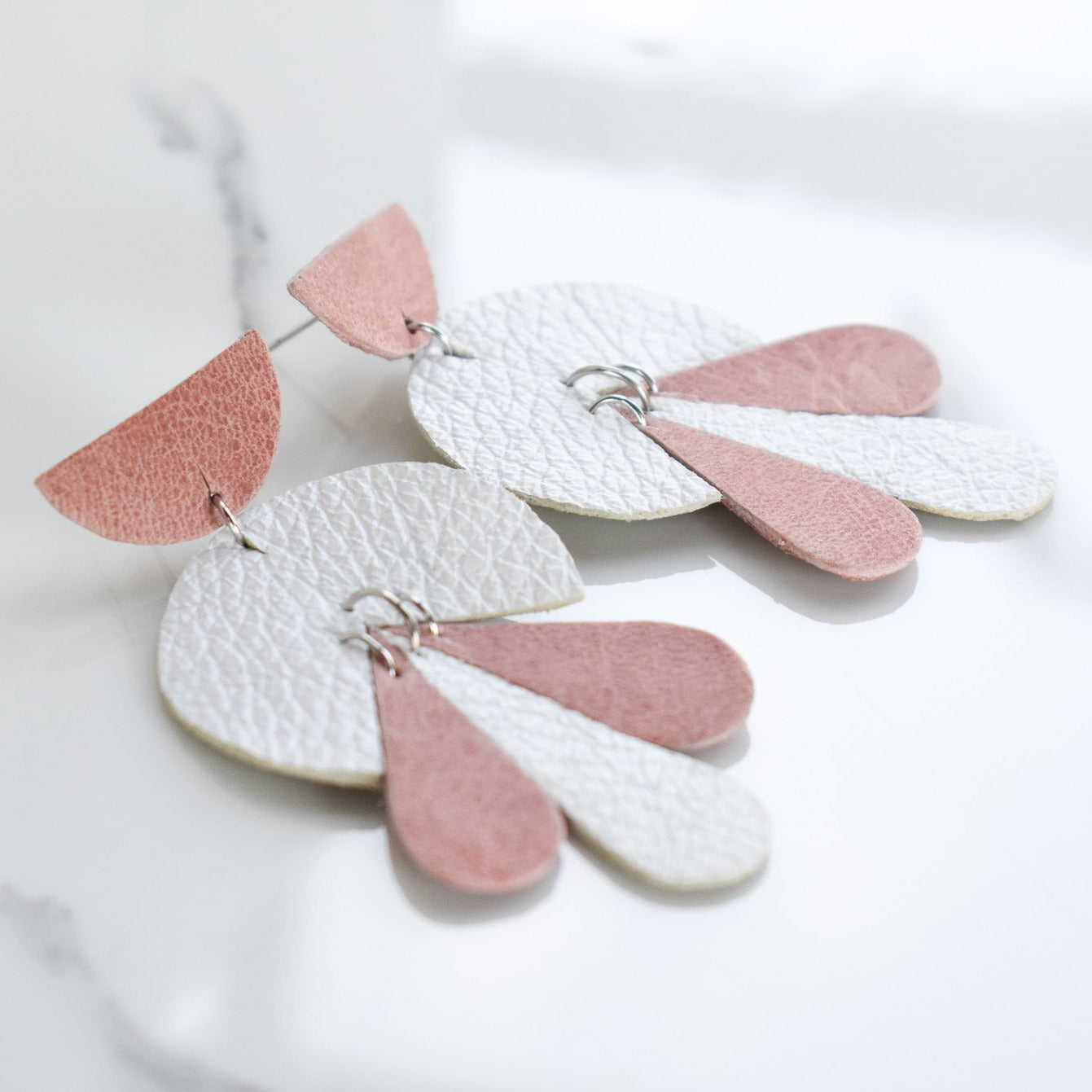 LEATHER_EARRING Handmade, light weight and comfortable to wear all day long leather earrings. All our earring hooks are made with a high quality stainless steel and they are hypo allergenic.  They will not tarnish or irritate your sensitive skin.