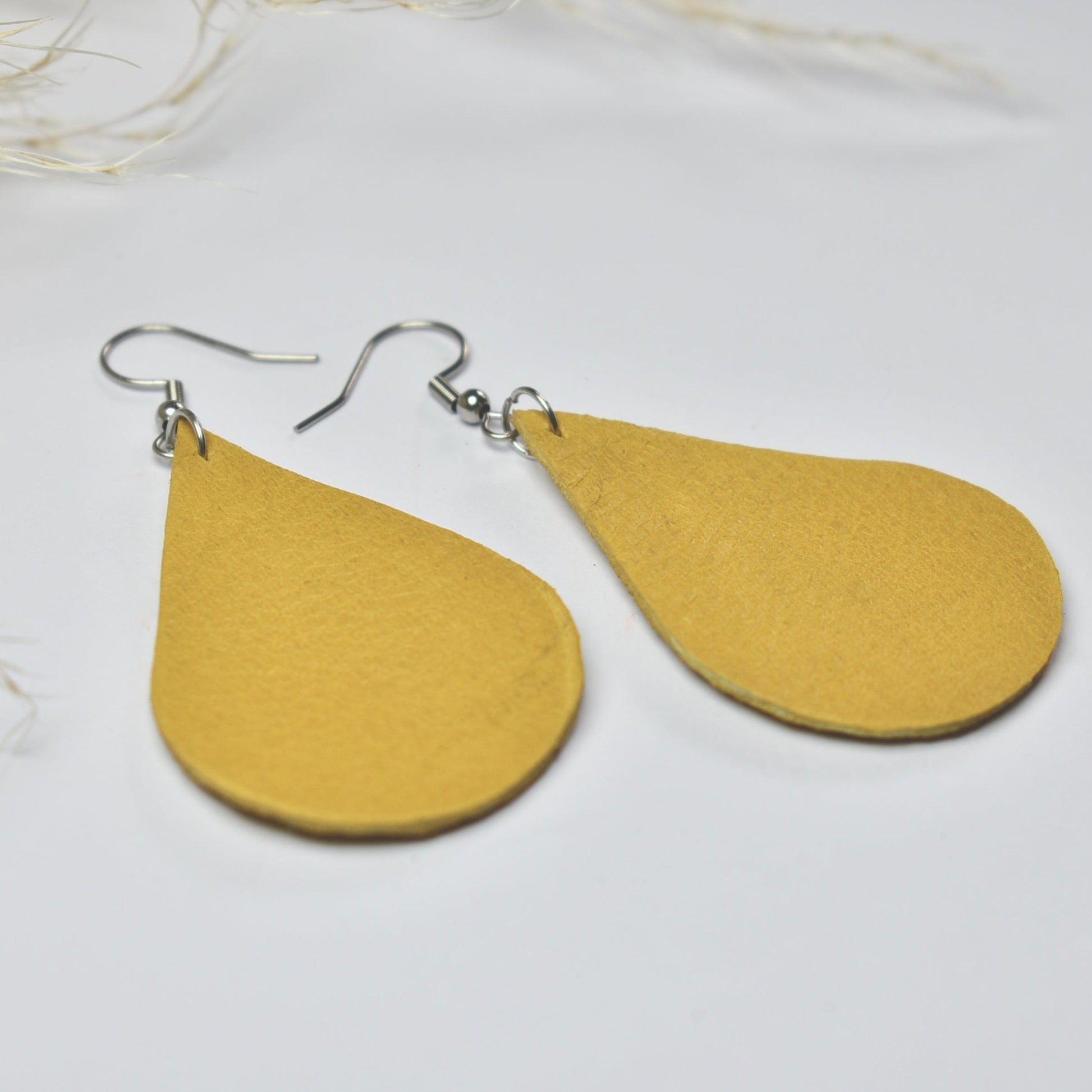 Handmade, light weight and comfortable to wear all day long leather earrings. All our earring hooks are made with a high quality stainless steel and they are hypo allergenic.  They will not tarnish or irritate your sensitive skin.