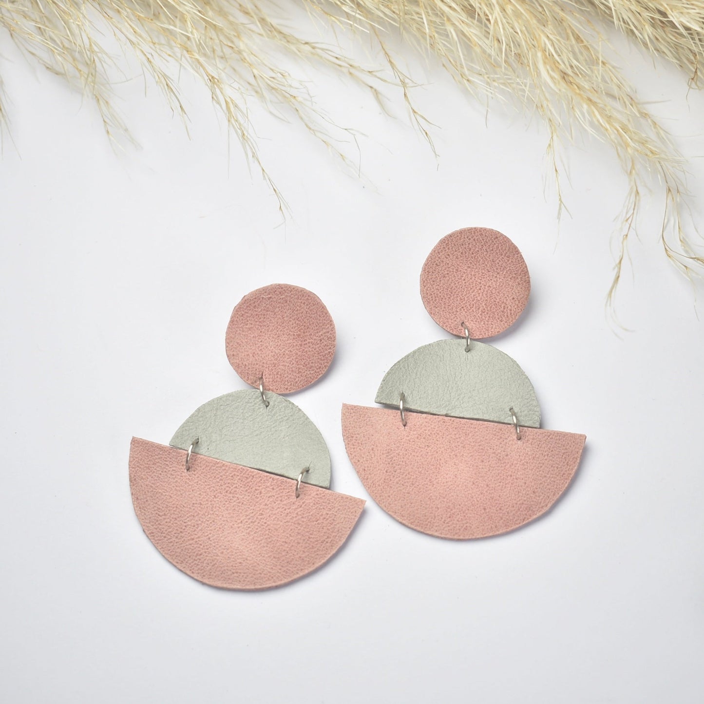 Handmade, light weight and comfortable to wear all day long leather earrings. All our earring hooks are made with a high quality stainless steel and they are hypo allergenic.  They will not tarnish or irritate your sensitive skin.