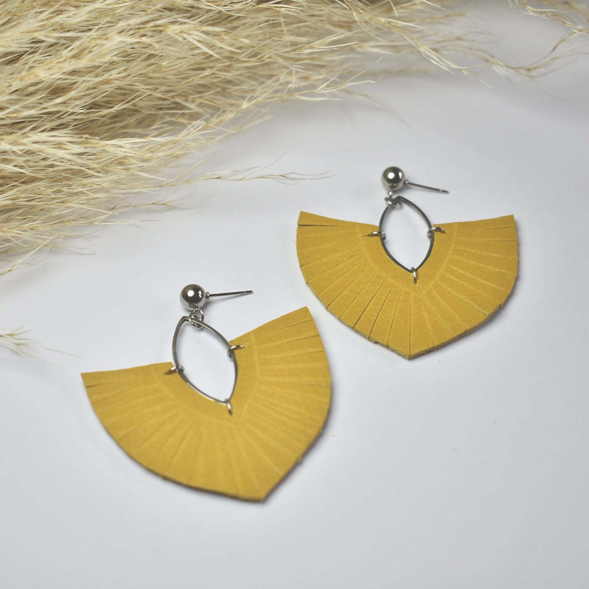 Handmade, light weight and comfortable to wear all day long leather earrings. All our earring hooks are made with a high quality stainless steel and they are hypo allergenic.  They will not tarnish or irritate your sensitive skin.