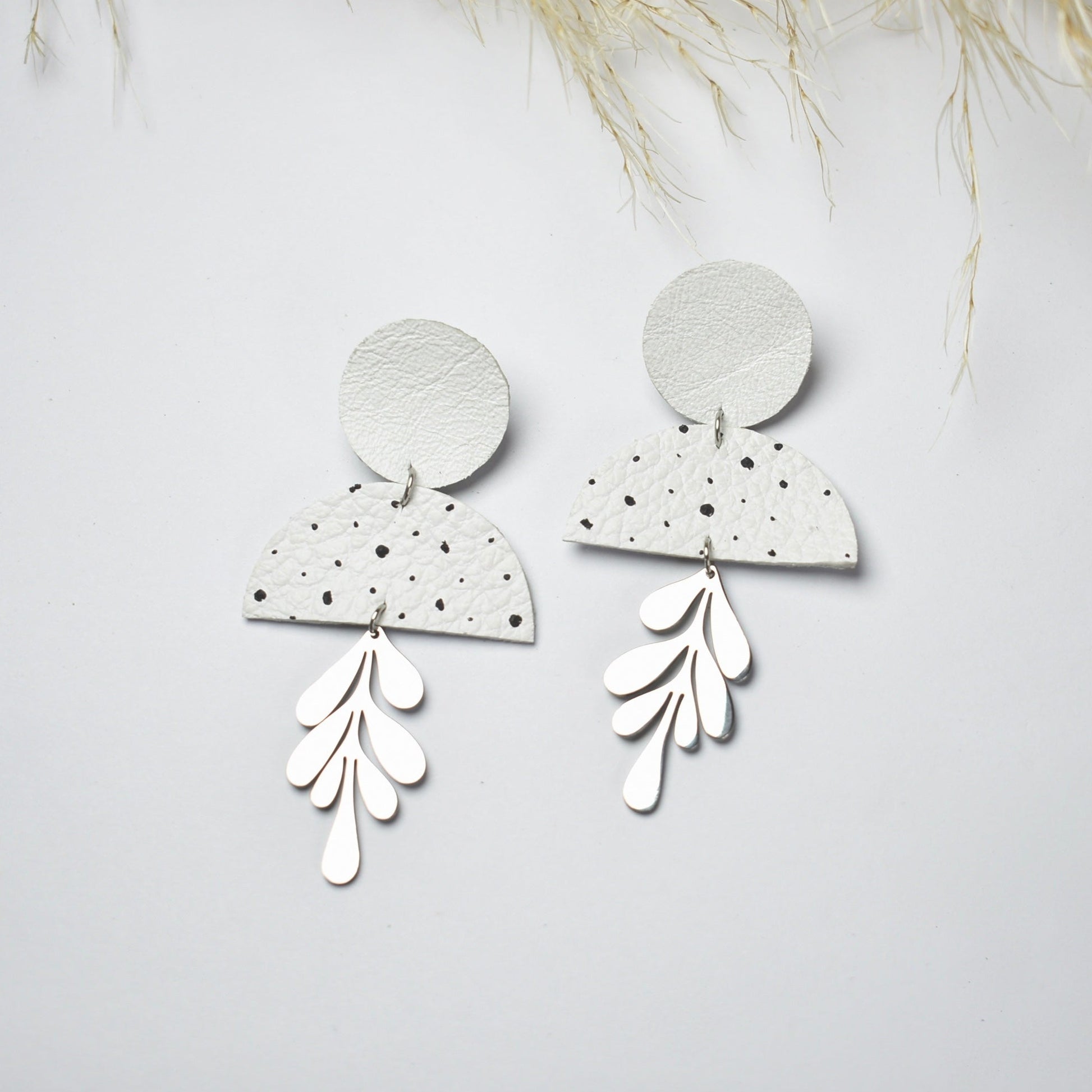 Handmade, light weight and comfortable to wear all day long leather earrings. All our earring hooks are made with a high quality stainless steel and they are hypo allergenic.  They will not tarnish or irritate your sensitive skin.