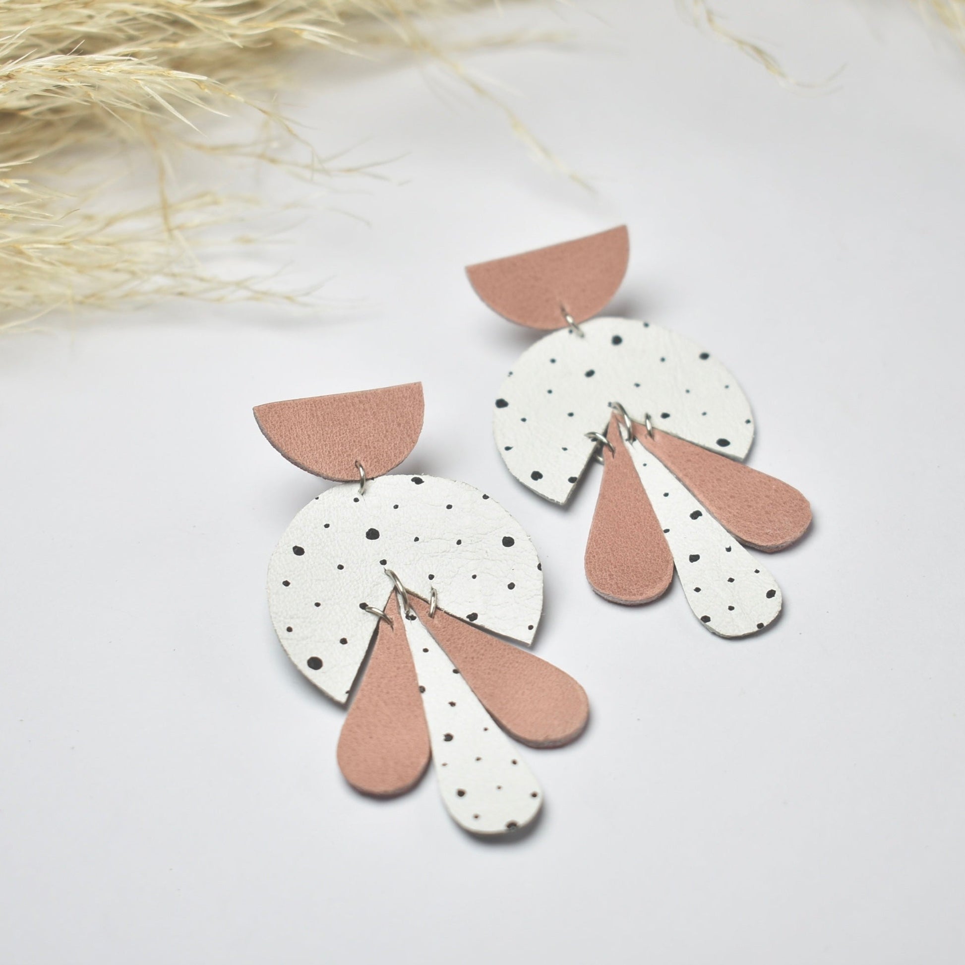 Handmade, light weight and comfortable to wear all day long leather earrings. All our earring hooks are made with a high quality stainless steel and they are hypo allergenic.  They will not tarnish or irritate your sensitive skin.