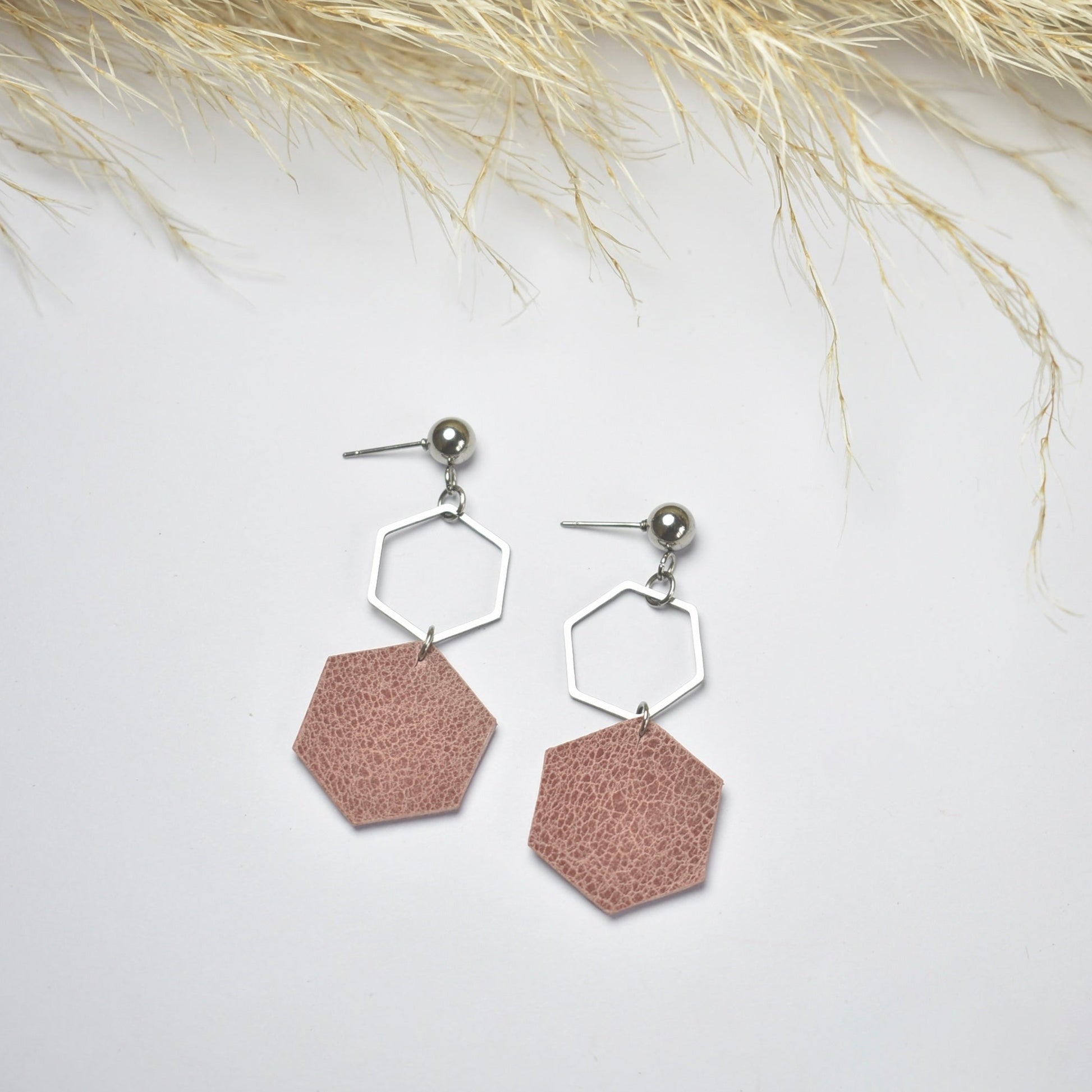 Handmade, light weight and comfortable to wear all day long leather earrings. All our earring hooks are made with a high quality stainless steel and they are hypo allergenic.  They will not tarnish or irritate your sensitive skin.