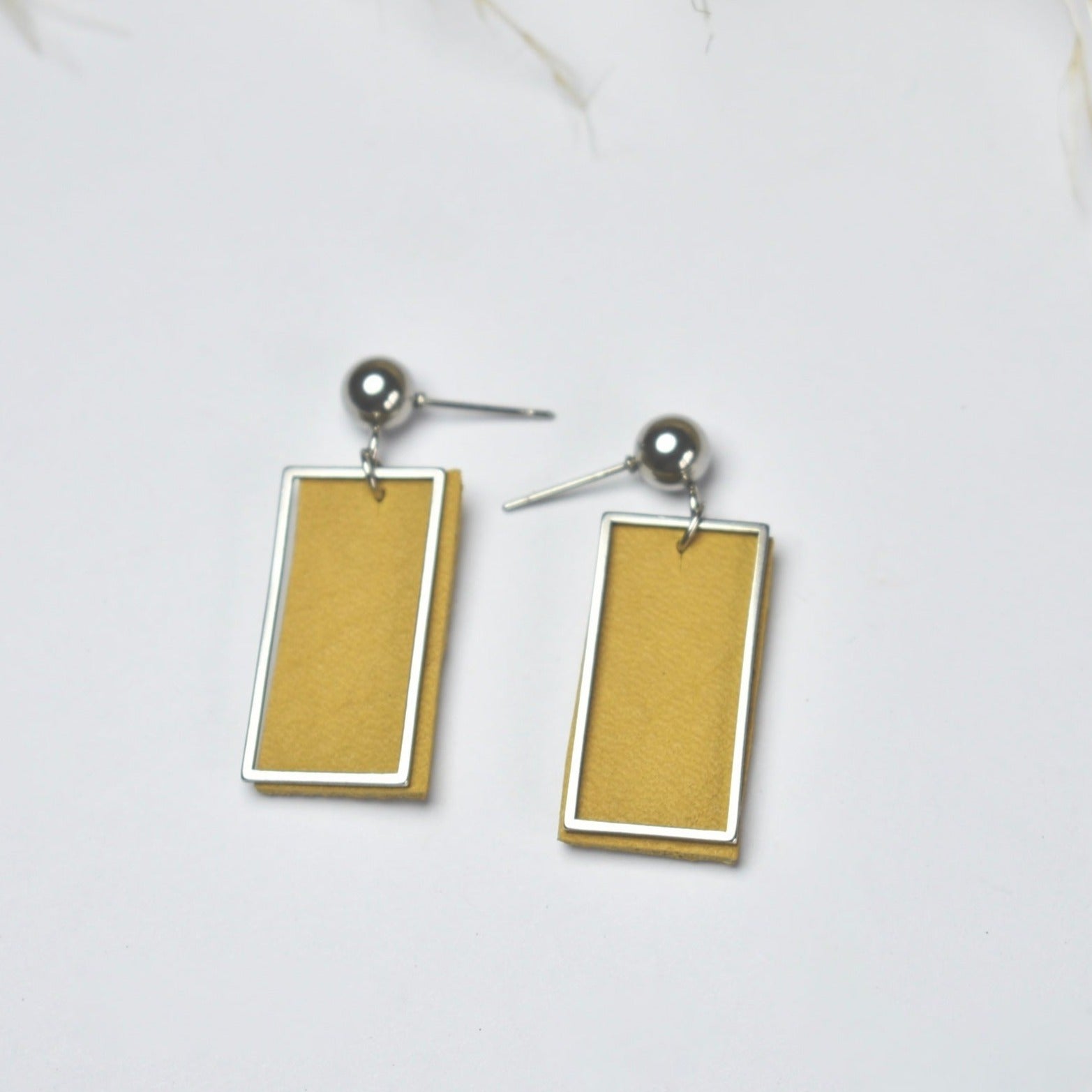 Handmade, light weight and comfortable to wear all day long leather earrings. All our earring hooks are made with a high quality stainless steel and they are hypo allergenic.  They will not tarnish or irritate your sensitive skin.