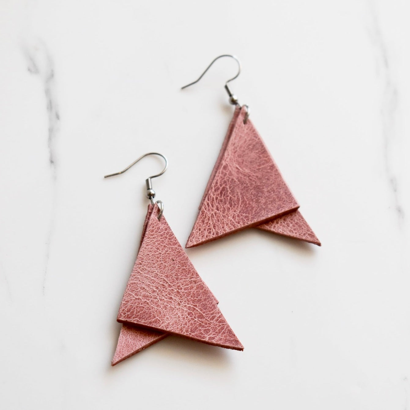 Handmade, light weight and comfortable to wear all day long leather earrings. All our earring hooks are made with a high quality stainless steel and they are hypo allergenic.  They will not tarnish or irritate your sensitive skin.