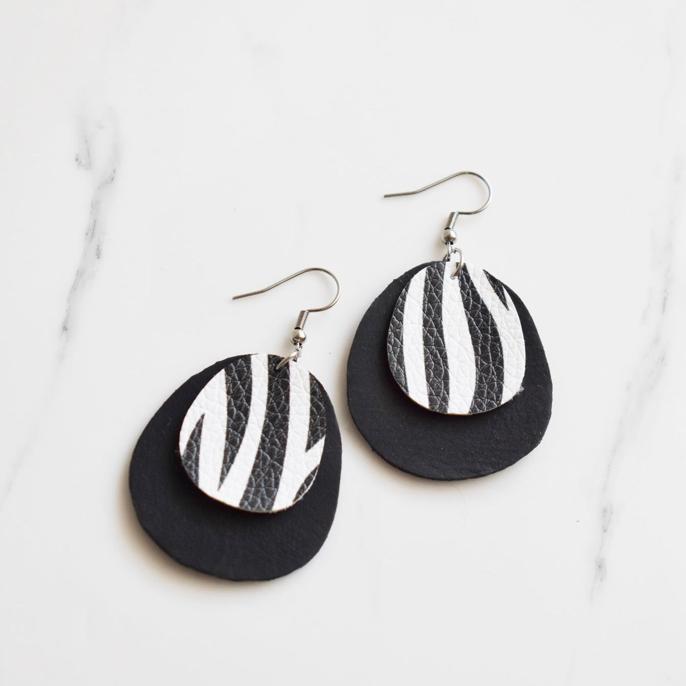 Handmade, light weight and comfortable to wear all day long leather earrings. All our earring hooks are made with a high quality stainless steel and they are hypo allergenic.  They will not tarnish or irritate your sensitive skin.