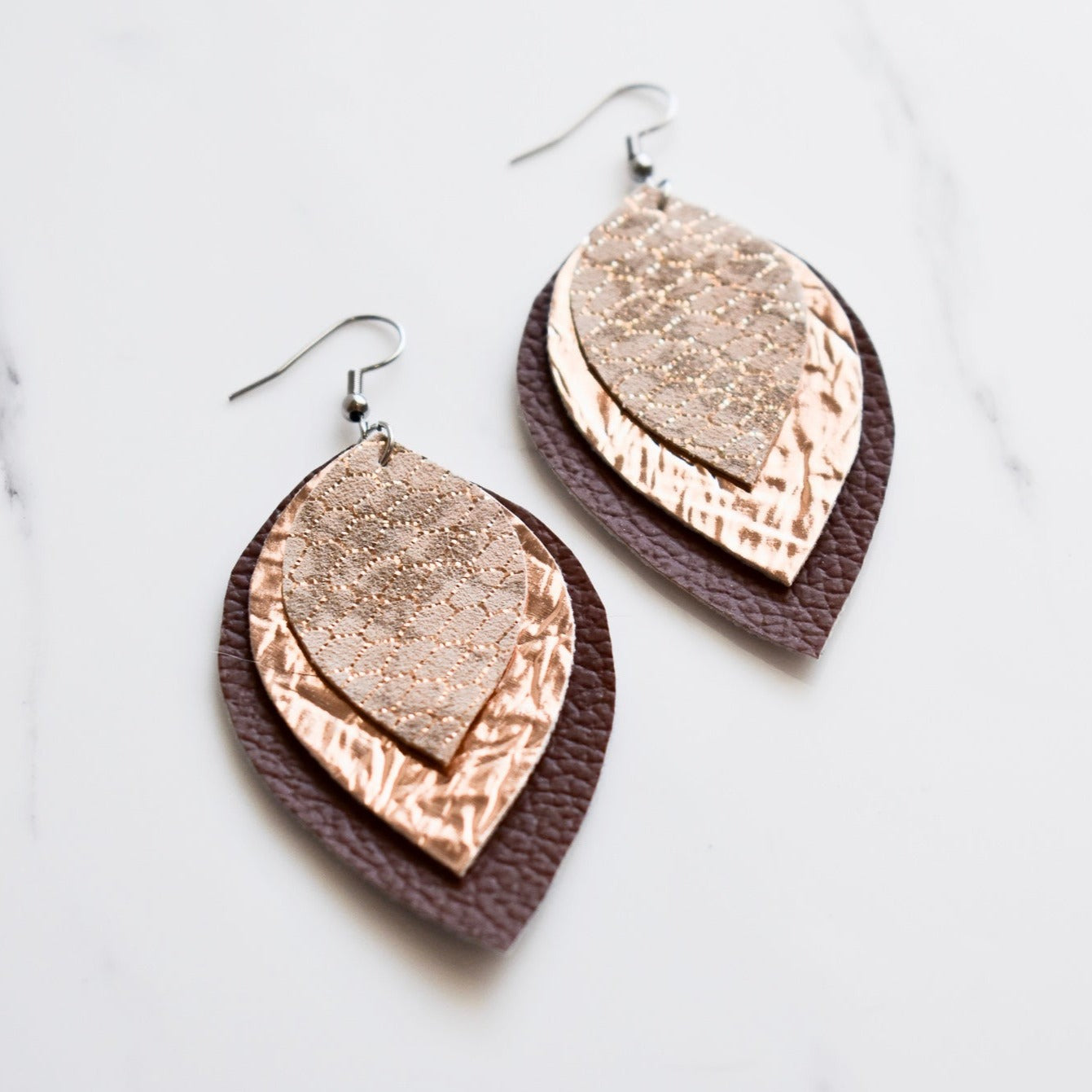 Handmade, light weight and comfortable to wear all day long leather earrings. All our earring hooks are made with a high quality stainless steel and they are hypo allergenic.  They will not tarnish or irritate your sensitive skin.